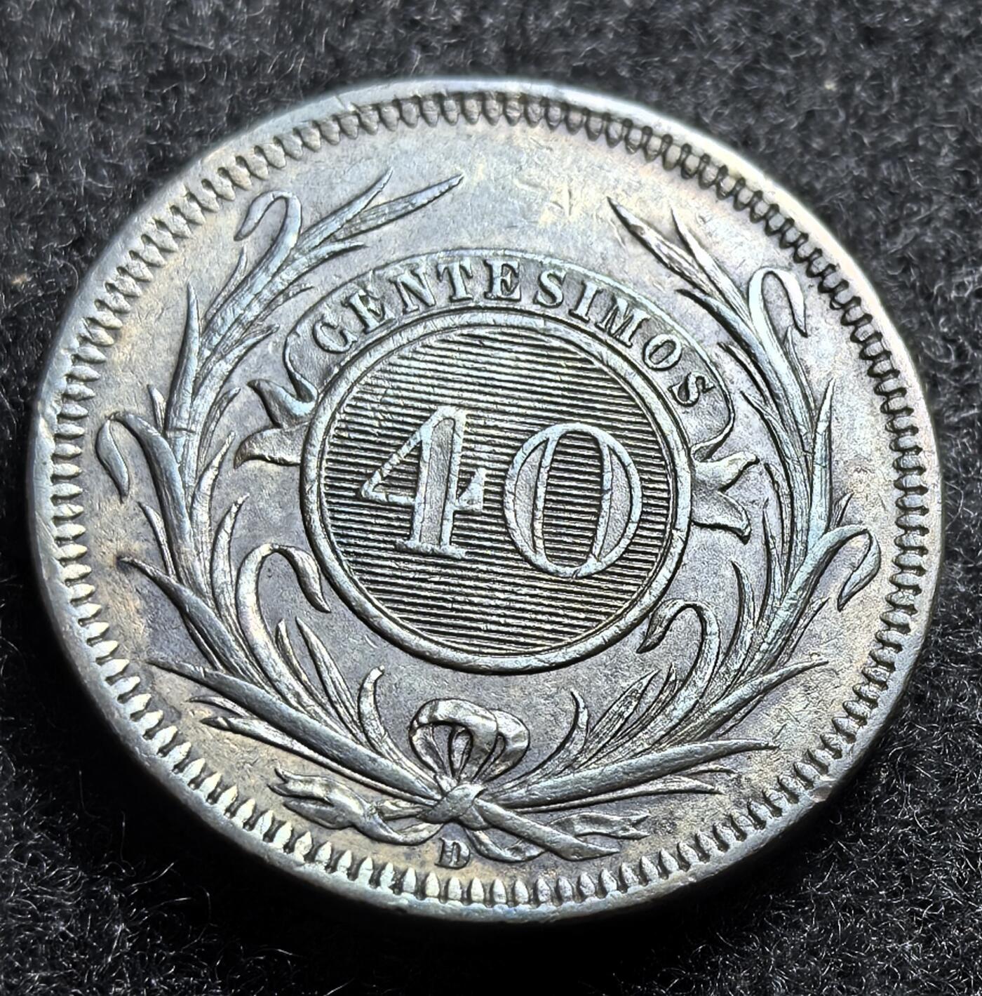 西班牙、丹属西印度、法属殖民地、乌拉圭银币古铜币，周五晚上九点倒数截拍，满百包邮，可寄存半年，喜欢朋友微信扫描二维码可直接参拍 UNC乌拉圭1857年40分厚重大铜币，km10