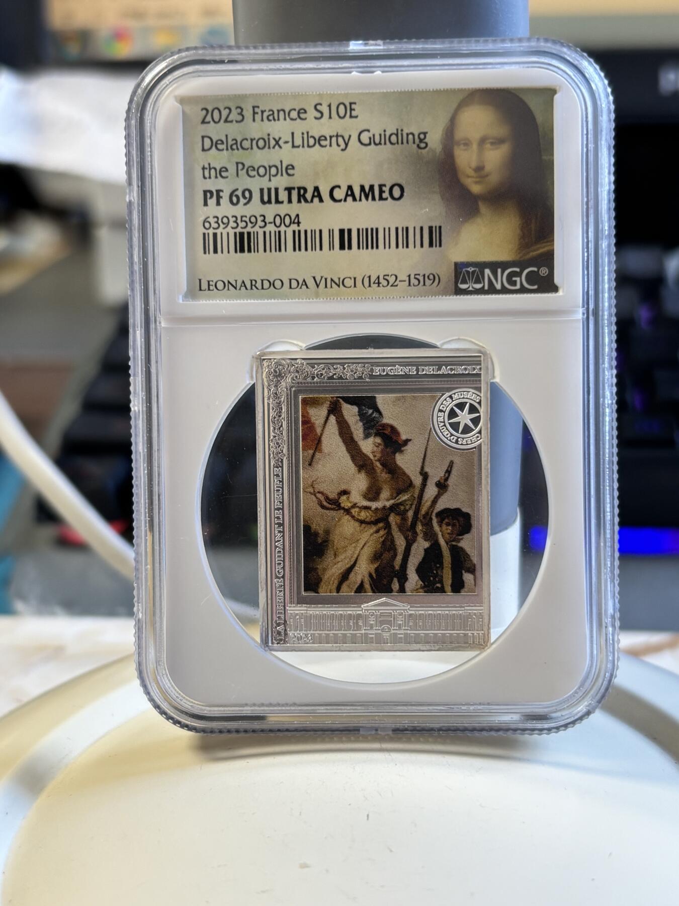 第181期拍卖  2023年法国10欧精制纪念彩色银币 自由指引人民NGC PF69 特殊蒙娜丽莎标，999银，22.2克