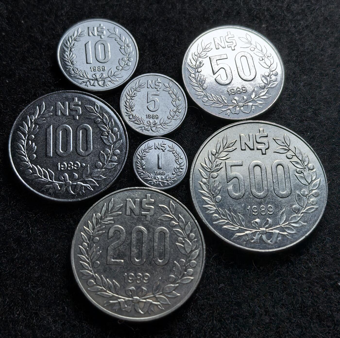 西班牙、丹属西印度、法属殖民地、乌拉圭银币古铜币，周五晚上九点倒数截拍，满百包邮，可寄存半年，喜欢朋友微信扫描二维码可直接参拍 乌拉圭1989年通货膨胀币七枚套，km92-98