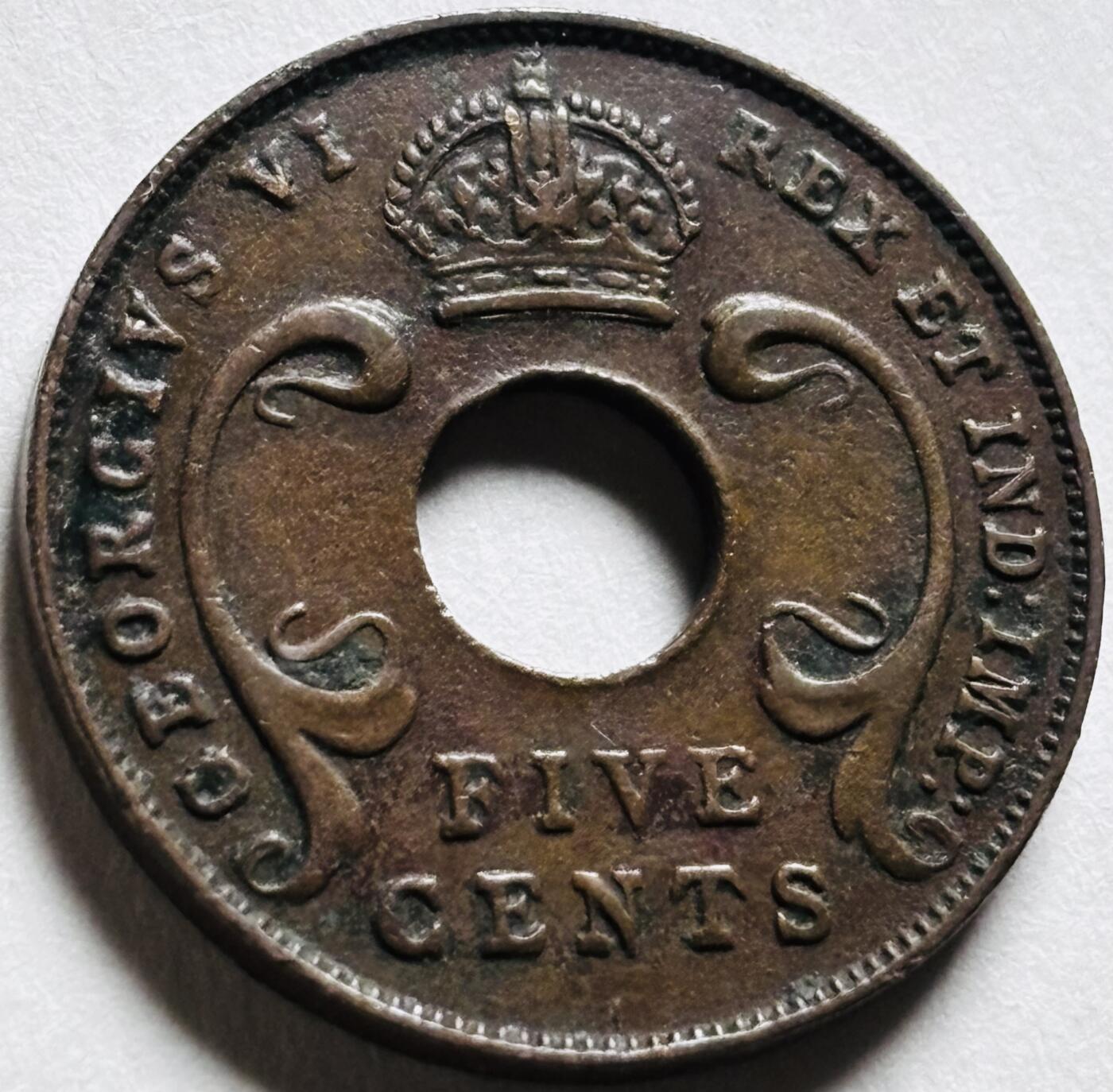 文馨钱币收藏第 279 场，银币，纪念铜章场 长期接收代拍品 少见极美品 1941 年英属东非乔治六世中孔 5 分铜币 I 版