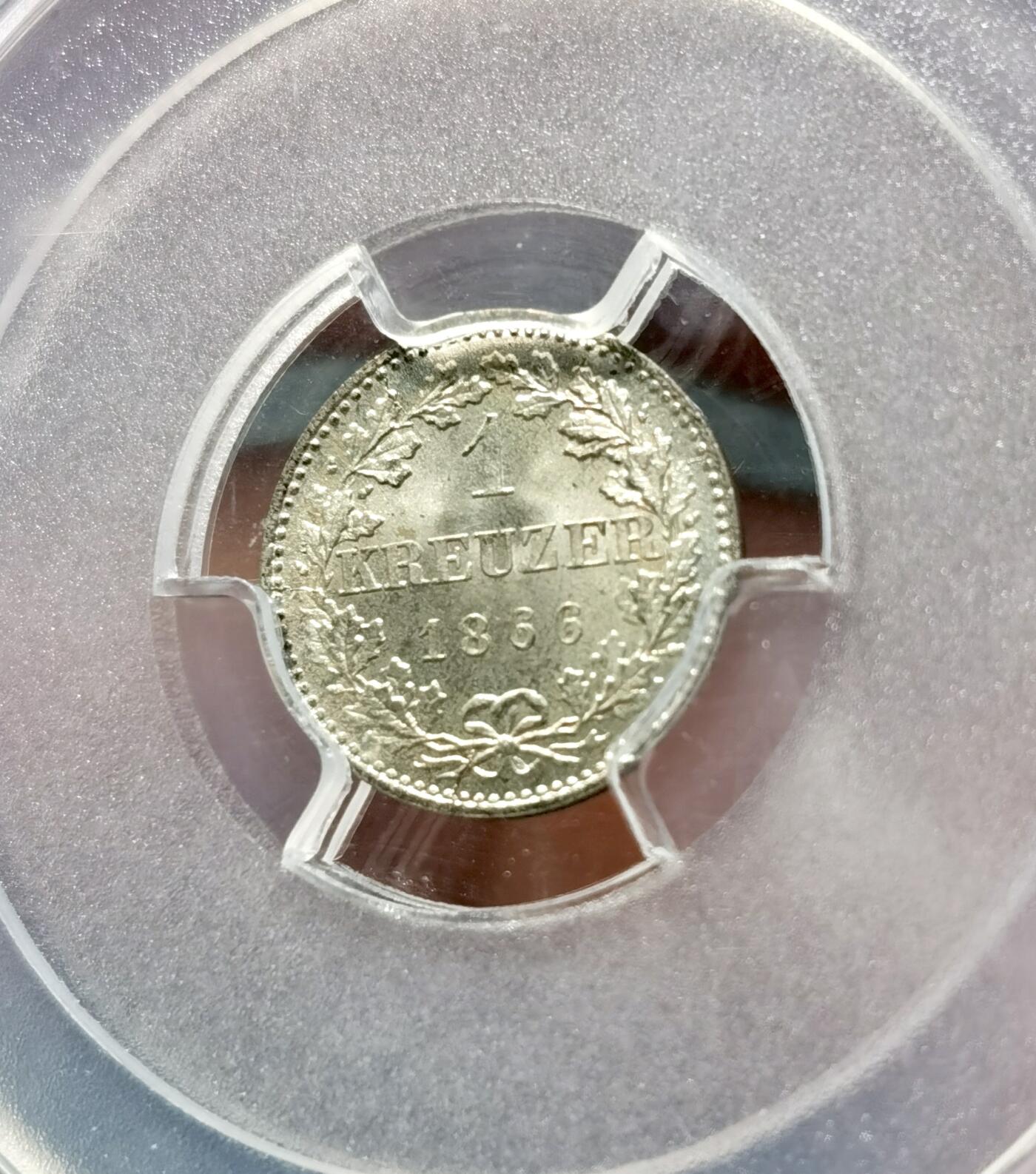 甄臻铺-世界币章拍卖（第38期）立冬小精品场，送拍享返佣金等优惠多多 NGC MS67 1866年德国法兰克福1克鲁泽银币。非常难得的高分，法兰克福经典双鹰徽章，底板如丝绸般细腻有光泽。无瑕疵的一枚精品。