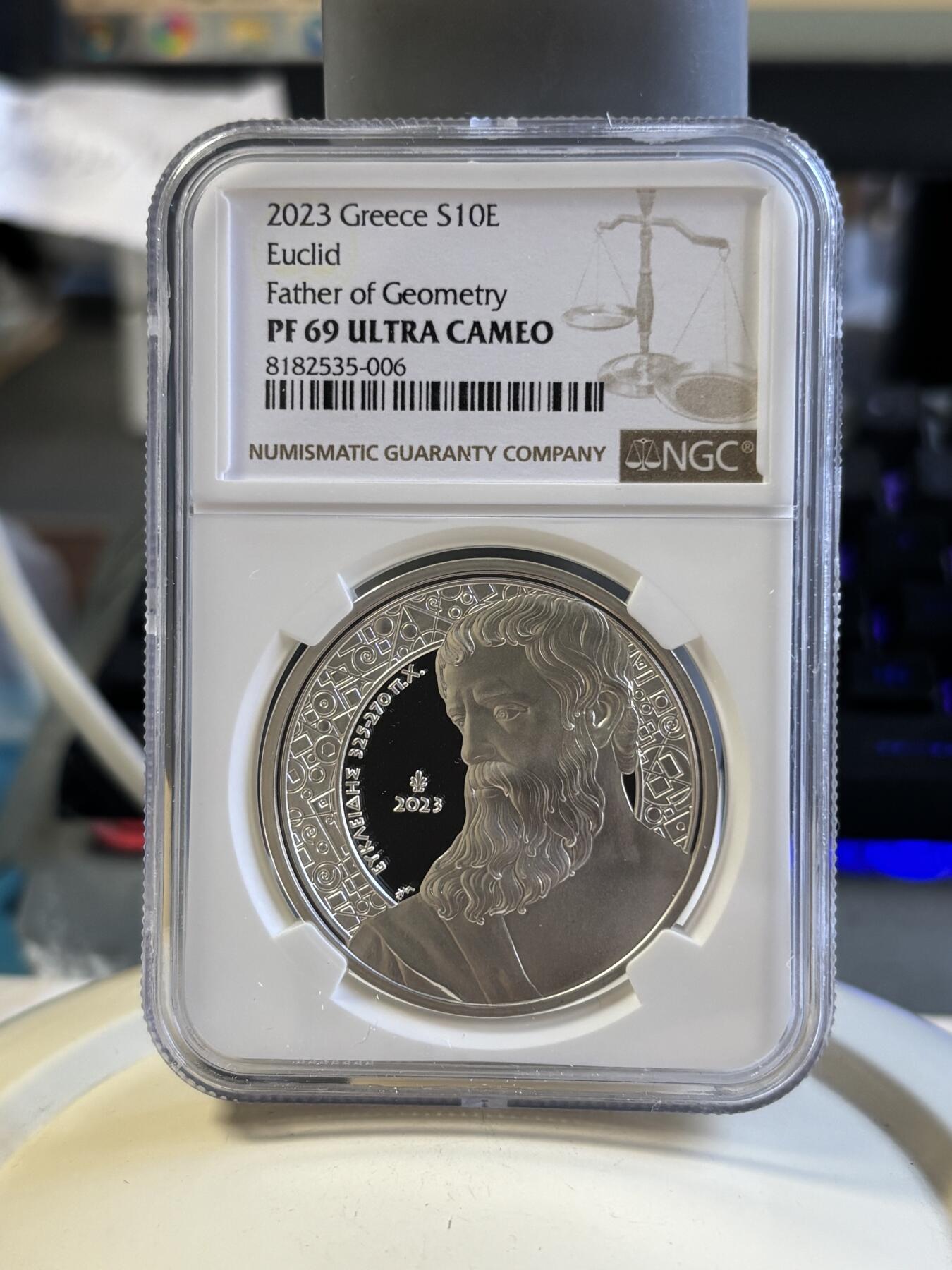 第181期拍卖  2023年希腊发行希腊文化系列--数学家欧几里得10欧元局部彩色精制纪念银币 NGC PF69原盒证书，34.1克，925银，发行1500枚