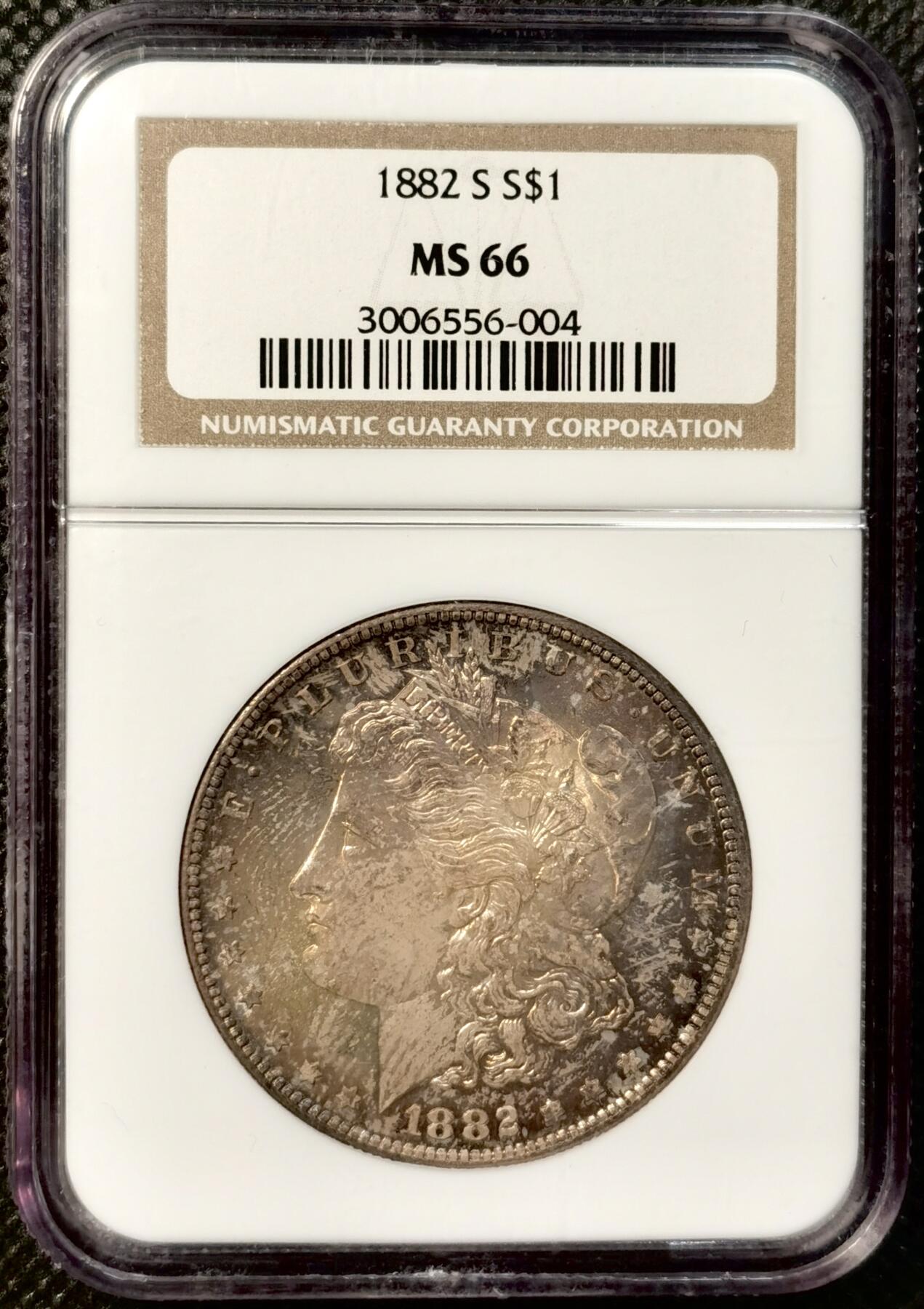 甄臻铺-世界币章拍卖（第38期）立冬小精品场，送拍享返佣金等优惠多多 NGC-MS66 1882年S版摩根，金炫彩包浆，顶级高分，少见年份。参考麦稀奇25年9月底白币成交价2708元