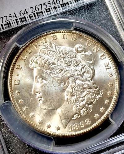 甄臻铺-世界币章拍卖（第38期）立冬小精品场，送拍享返佣金等优惠多多 PCGS-MS64 美国1898年O版摩根一元银币，发行量相对较少，带黄油光环彩