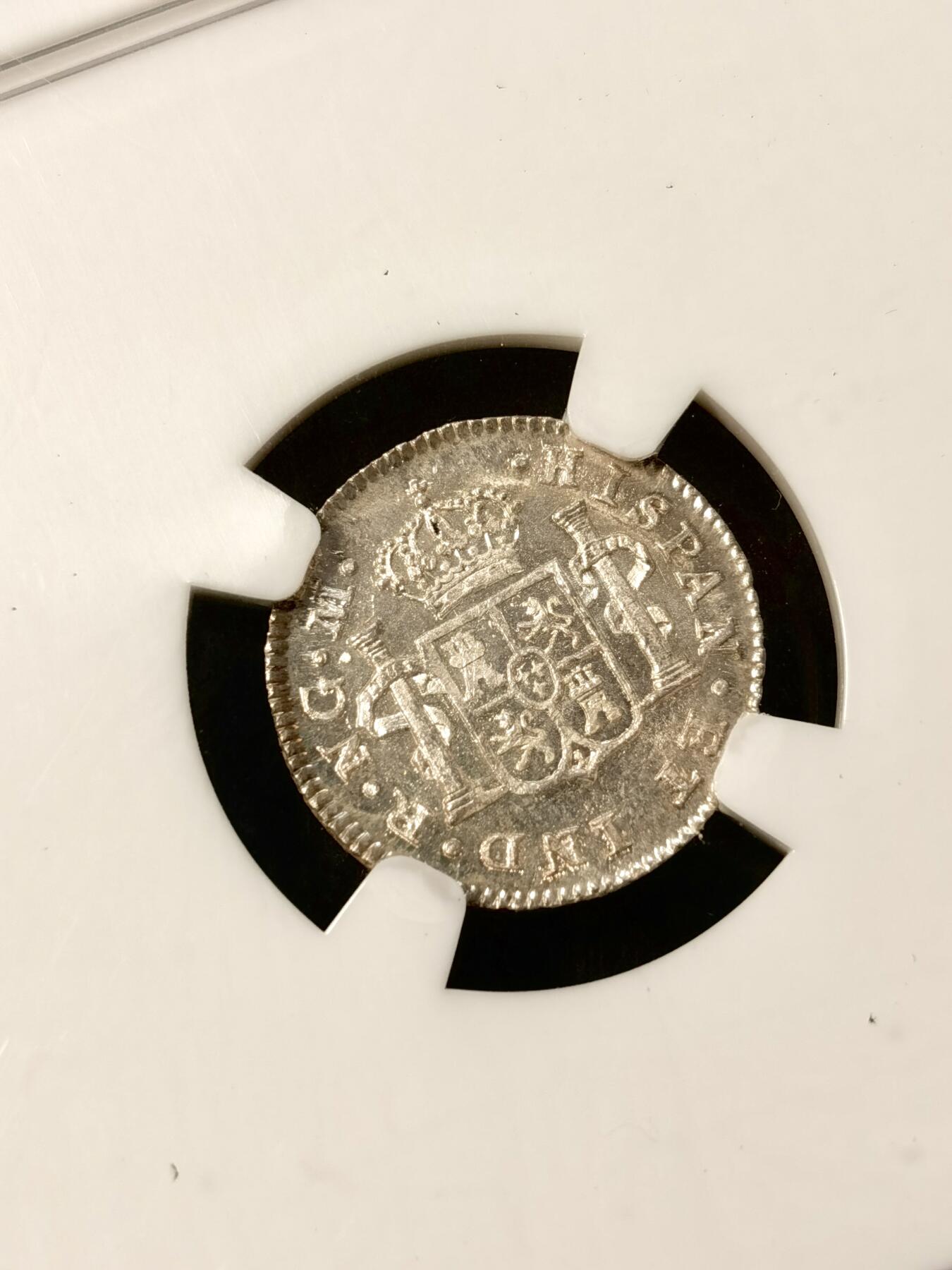 甄臻铺-世界币章拍卖（第38期）立冬小精品场，送拍享返佣金等优惠多多 NGC-MS64 1820年西属危地马拉费迪南七世1/2R小银币 五彩包浆 镜面底板 状态非常好 少见的小面值双柱 足以自藏的一枚 老盒严评 各位藏家把握入手机会 危地马拉比墨西哥 秘鲁 玻利维亚都要少