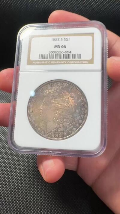 甄臻铺-世界币章拍卖（第38期）立冬小精品场，送拍享返佣金等优惠多多 NGC-MS66 1882年S版摩根，金炫彩包浆，顶级高分，少见年份。参考麦稀奇25年9月底白币成交价2708元