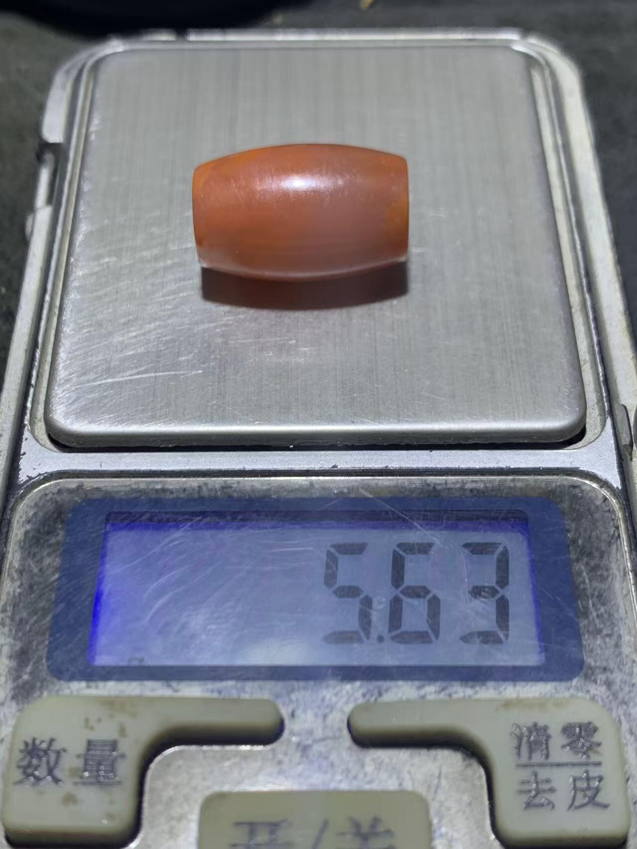 川料冰飘柿子红南红玛瑙随形桶珠一颗！