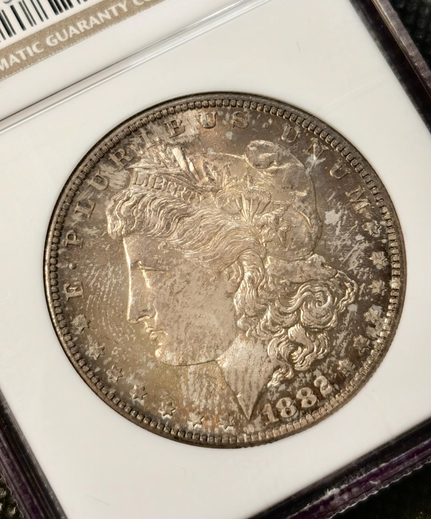 甄臻铺-世界币章拍卖（第38期）立冬小精品场，送拍享返佣金等优惠多多 NGC-MS66 1882年S版摩根，金炫彩包浆，顶级高分，少见年份。参考麦稀奇25年9月底白币成交价2708元