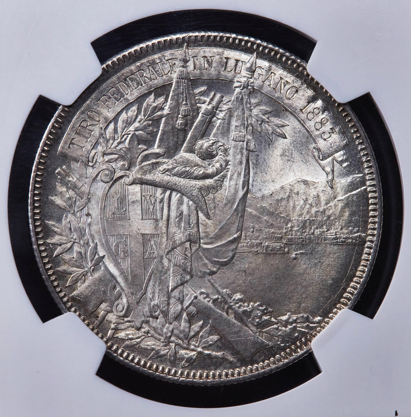 【俄甄集藏】2025年(044)11-12星期三晚 19:30 全场包邮 瑞士1883年卢伽诺射击节5法郎大银币，NGC MS65，黄油彩转光，顶级品相，经典品种