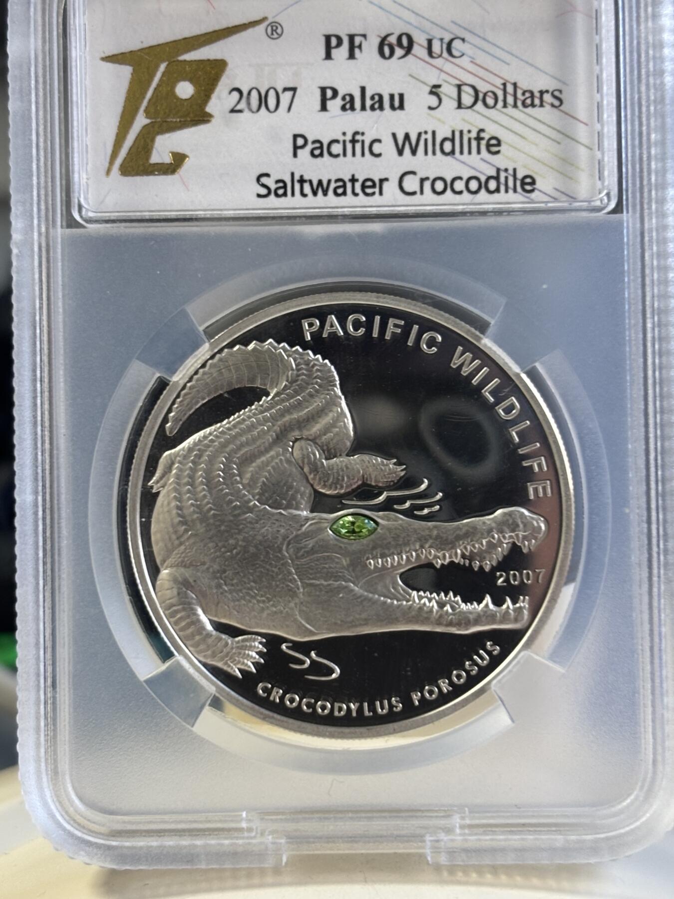 第181期拍卖 帕劳2007年太平洋濒危动物鳄鱼镶嵌绿水晶纪念银币TQG-PF69，925银，25克，发行量2500枚