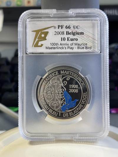 第181期拍卖 - 比利时2008年欧洲之星系列-莫里斯·梅特林克戏剧《蓝色小镇》上演100周年（蓝鸟）10欧局部彩色精制银币TQG PF66UC  925银 18.75克 发行量：约2万枚 