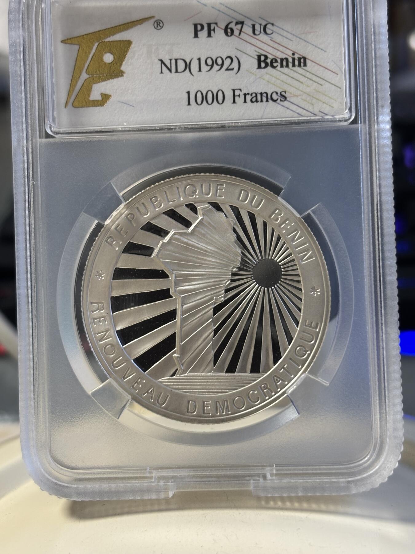 第181期拍卖 稀少贝宁1992年阳光地图1000法郎精制纪念银币评级67分，999银，20克