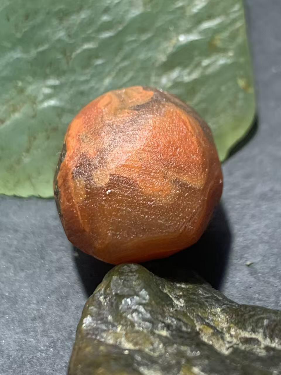 精美柿子红荔枝冻南红玛瑙明料原石一颗