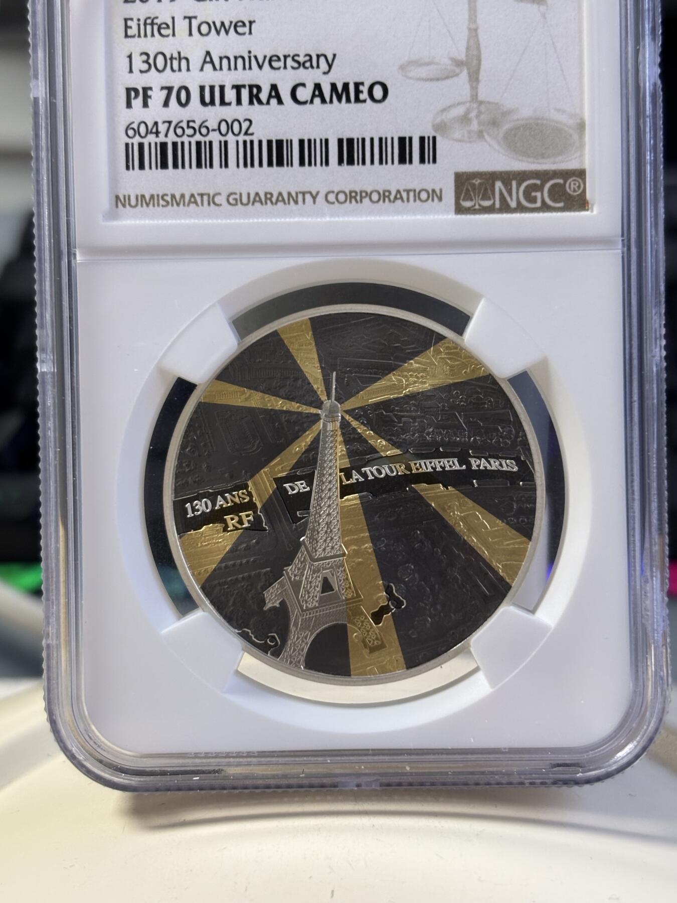 第181期拍卖 法国2019年埃菲尔铁塔130周年镀金镀铑银币NGC-PF70无盒无证书，金属:900银镀金镀铑，重量:22.2克，直径：37毫米发行：3000枚
