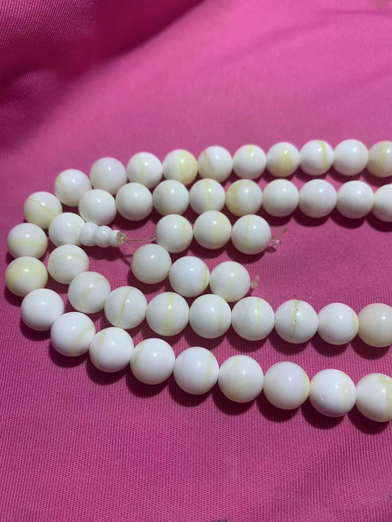 深海奶白飘黄金丝贝化玉108手串一条，