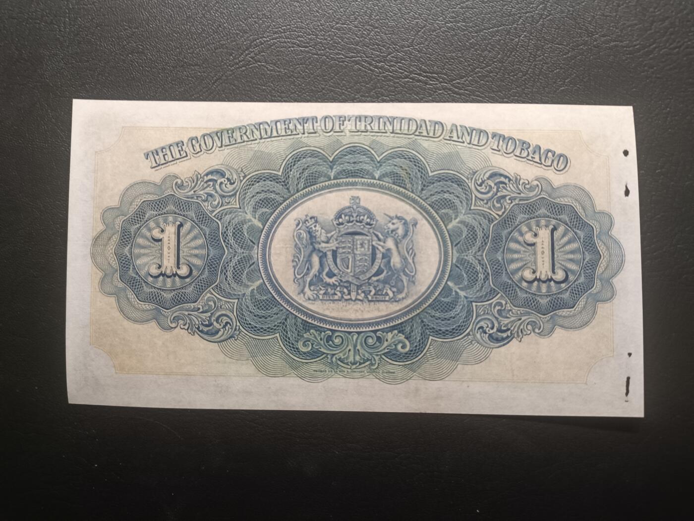 2025十一月第三期，总201期 英属特立尼达和多巴哥1939年1元UNC-有多处孔洞，海湾和总督府徽章，早期少见品种