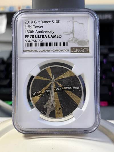 法国2019年埃菲尔铁塔130周年镀金镀铑银币NGC-PF70无盒无证书，金属:900银镀金镀铑，重量:22.2克，直径：37毫米发行：3000枚