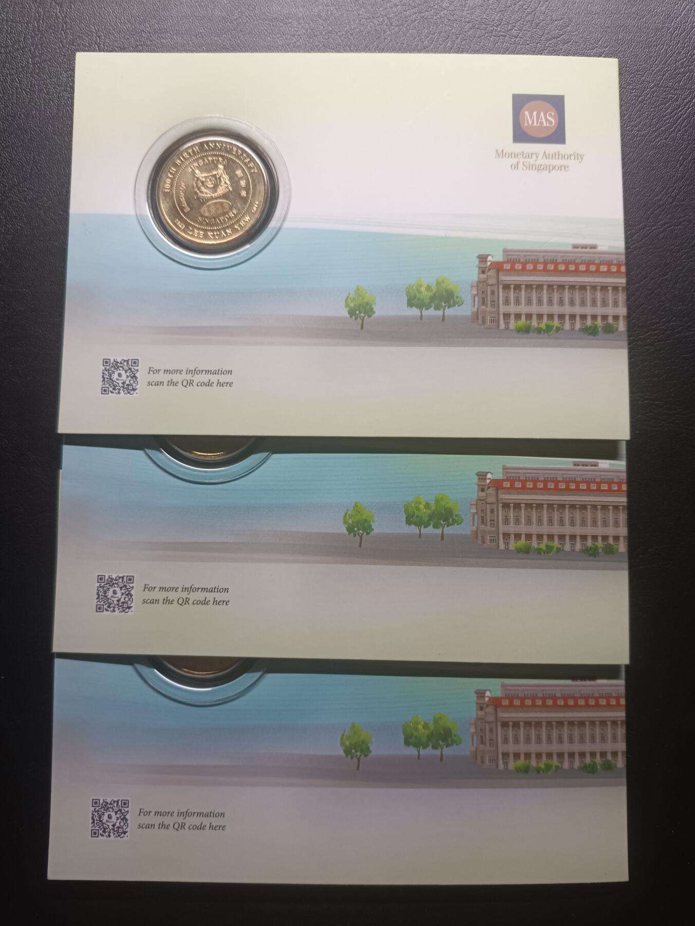 2025十一月第三期，总201期 【雨】新加坡2023年国父李光耀诞辰100周年铜制10元纪念币带册全新批量三枚，国会大楼和国花胡姬花