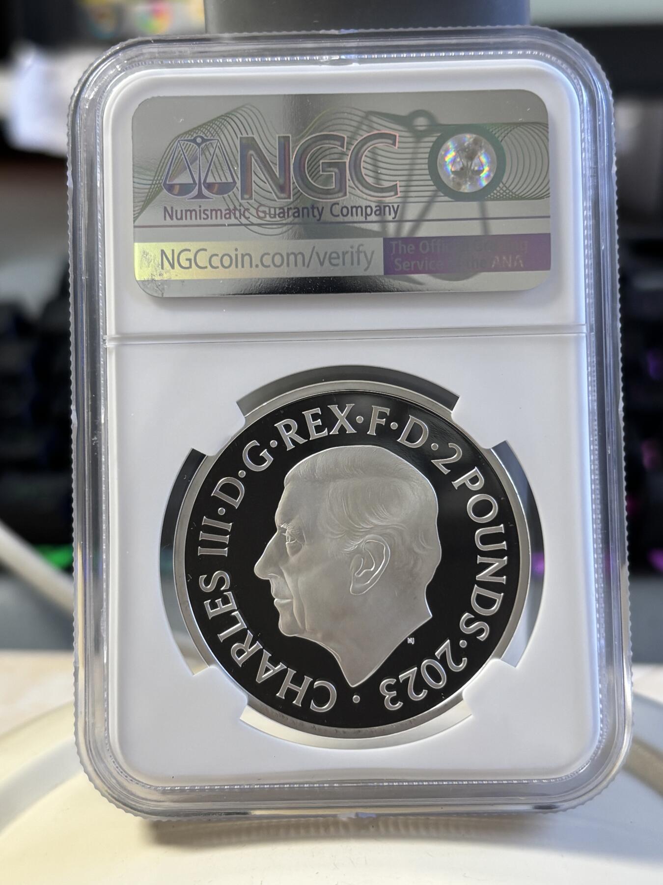 第181期拍卖 4枚套NGC-PF70英国2022年发行哈利波特25周年1哈利波特与魔法石1盎司精制银币2英镑，999银，发行量1万5千枚，盒证全。霍格沃兹特快列车精制1盎司纪念银币2英镑盒证全，999银，发行15000枚。首期NGC-PF70ULTRA CAMEO邓布利多教授1盎司精制银币2英镑，999银，，发行5000枚。霍格沃兹魔法学院1盎司纪念银币，999银，发行5000枚，评级盒有个碎口