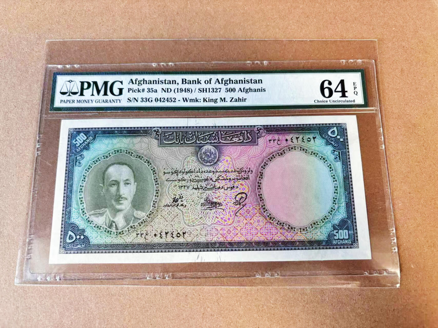 【Blue Auction】世界纸币精拍第749期——18级TOP拍卖/信誉/品质/专业/高效💫  阿富汗 1948年500阿富汗尼 状态佳 PMG64EPQ全新原票罕见 BWC出品 热门升值品种 非常少见次高值 渐变色小花底纹非常华丽 正面为末代国王查希尔 背面位于阿富汗北部马扎里沙里夫市著名的蓝色清真寺（Blue Mosque）许多阿富汗人认为塔利卜安葬于此，这座神殿始建于1136年，以其精美的蓝色瓷砖而闻名遐迩