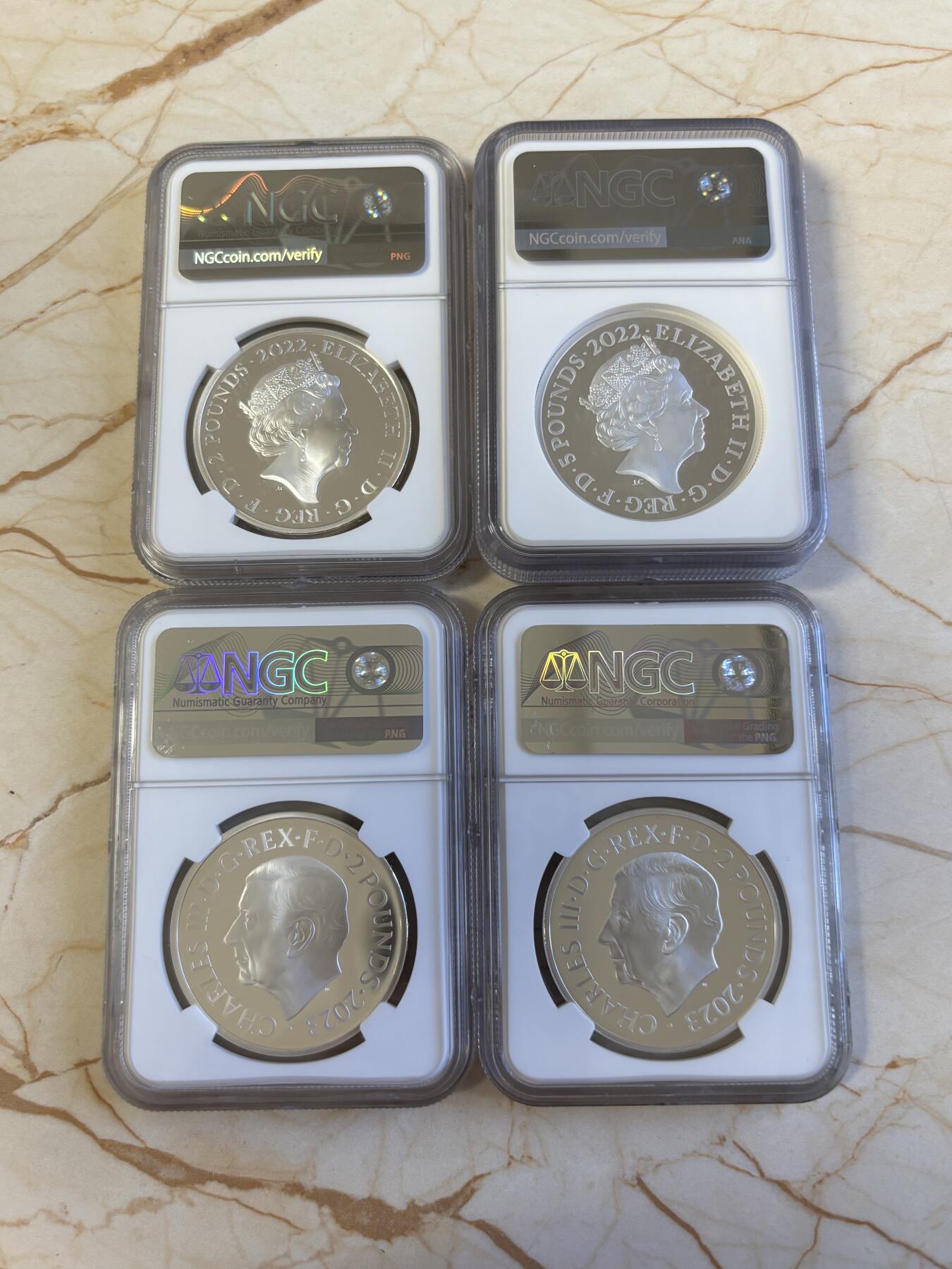 第181期拍卖 4枚套NGC-PF70英国2022年发行哈利波特25周年1哈利波特与魔法石1盎司精制银币2英镑，999银，发行量1万5千枚，盒证全。霍格沃兹特快列车精制1盎司纪念银币2英镑盒证全，999银，发行15000枚。首期NGC-PF70ULTRA CAMEO邓布利多教授1盎司精制银币2英镑，999银，，发行5000枚。霍格沃兹魔法学院1盎司纪念银币，999银，发行5000枚，评级盒有个碎口