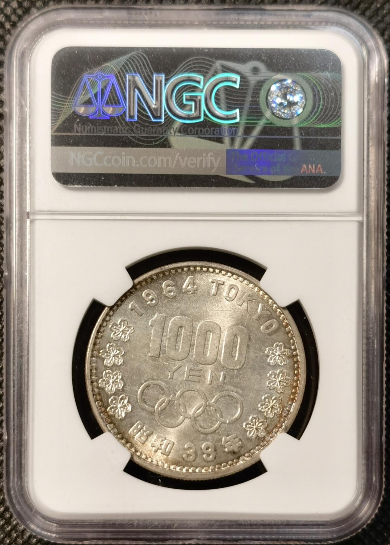 甄臻铺-世界币章拍卖（第39期）送拍享返佣金等优惠多多 NGC-MS63 日本1964年东京奥运1000元银币 淡包浆