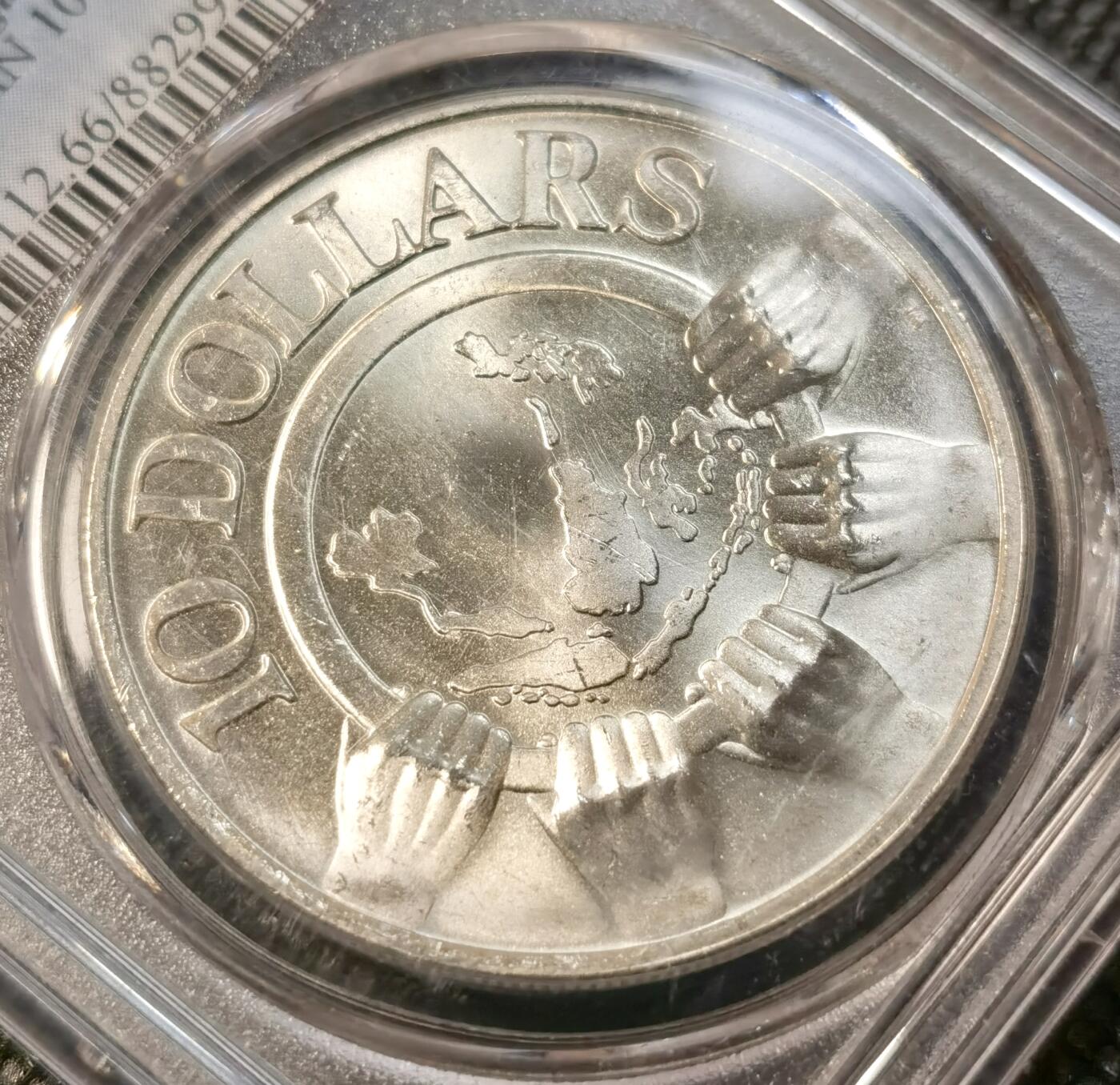 甄臻铺-世界币章拍卖（第39期）送拍享返佣金等优惠多多 PCGS-MS66 新加坡1977年10元精制银币 31克 东盟成立10周年纪念币