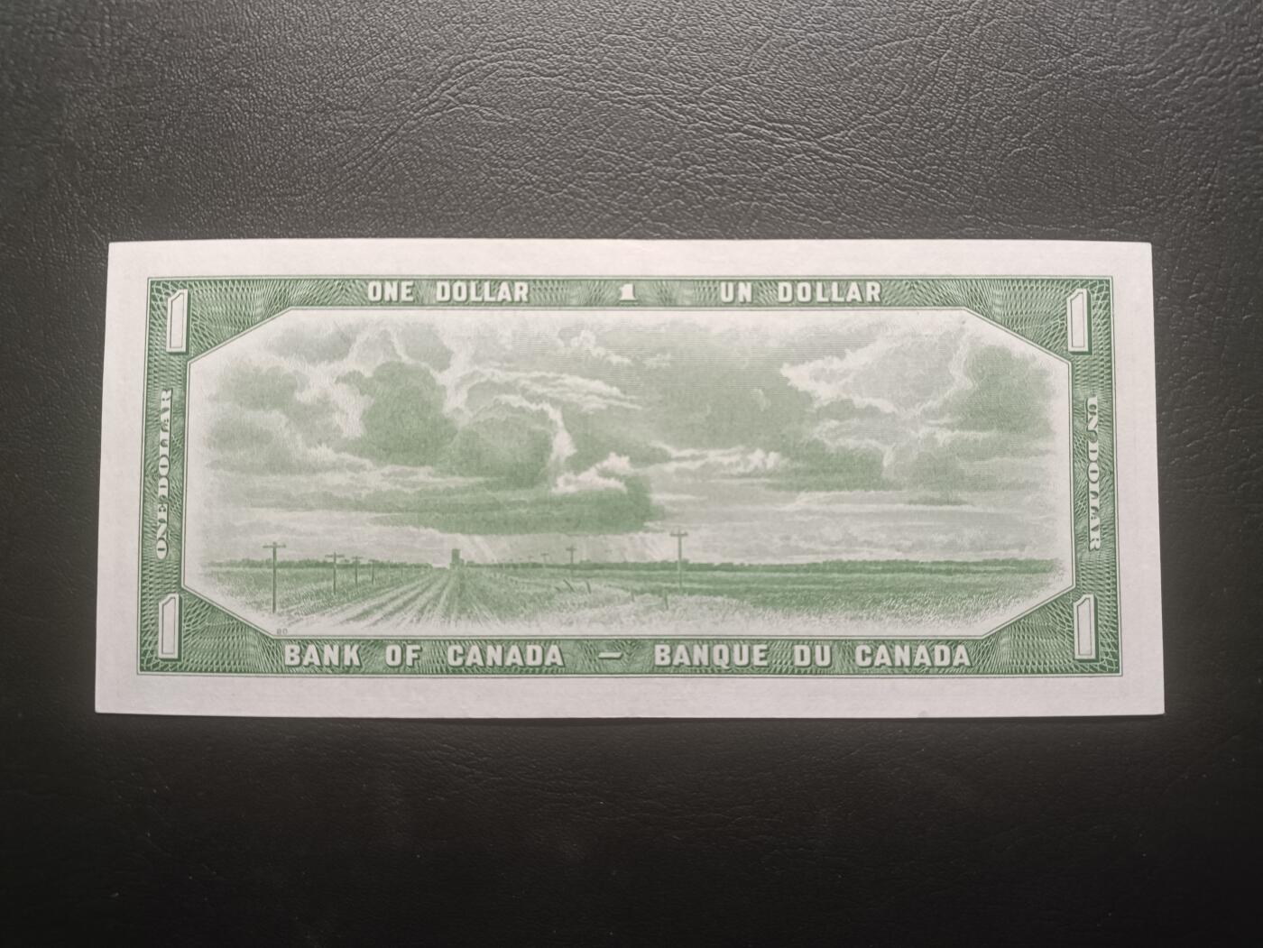 2025十一月第四期，总202期 加拿大1954版1元“魔鬼脸”版本首签UNC-有挤纸，因新发行纸币的女王发型可以看出来一个魔鬼向下看的脸而被舆论攻击，从而紧急改版，导致此版本稀少