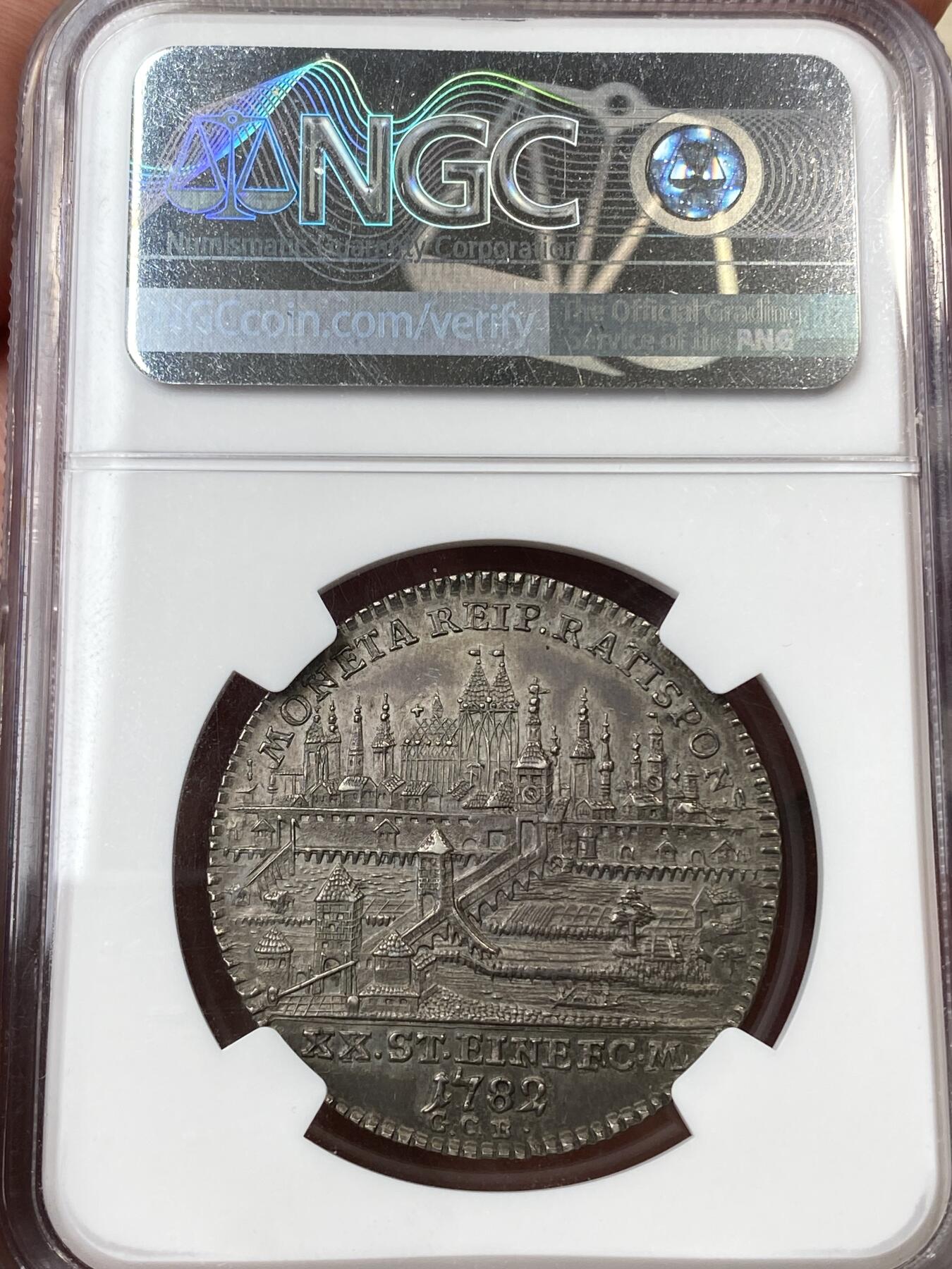 万国钱币拍卖第055期 NGC MS61 1782年德国雷根斯堡自由市1/2景观泰勒 正面为神圣罗马帝国皇帝约瑟夫二世 全深打原味景观极其难得 高点细节极佳 原味欧陆包浆收藏级