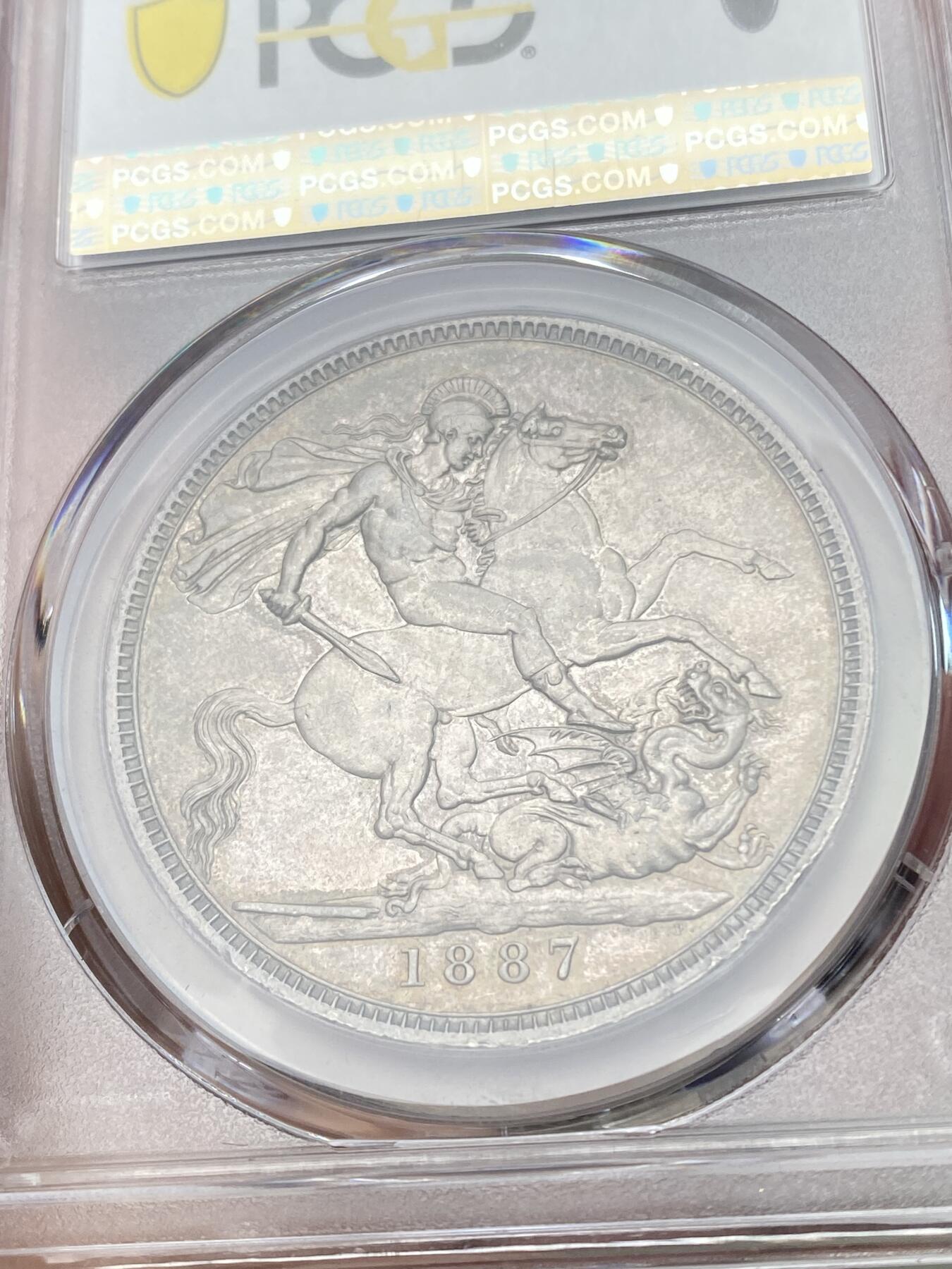 万国钱币拍卖第055期 PCGS MS63 1887年英国维多利亚女皇高冠马剑克朗 英系乌云酱彩包浆