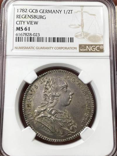 万国钱币拍卖第055期 - NGC MS61 1782年德国雷根斯堡自由市1/2景观泰勒 正面为神圣罗马帝国皇帝约瑟夫二世 全深打原味景观极其难得 高点细节极佳 原味欧陆包浆收藏级