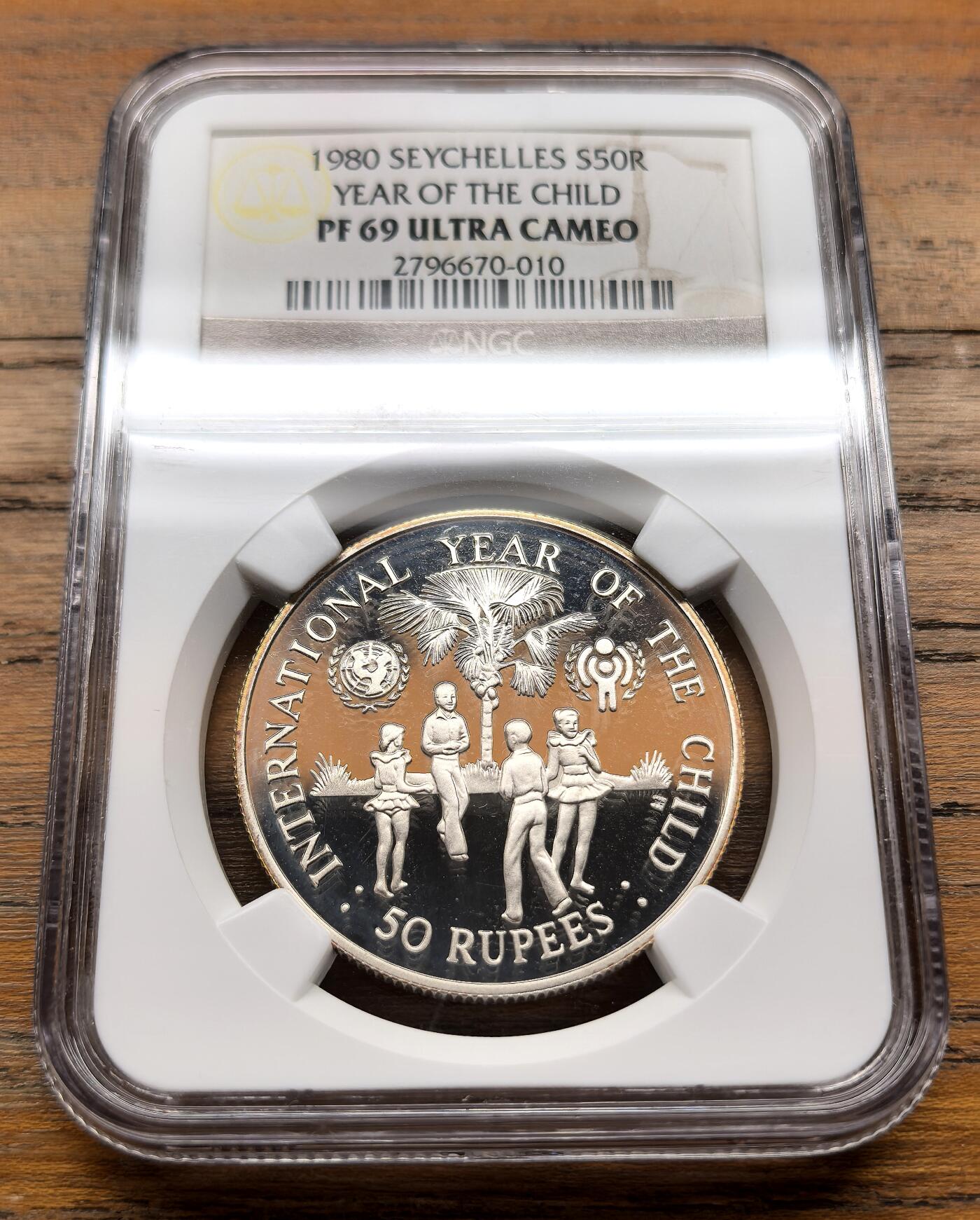 泉海漫舟·凡希社世界钱币微拍第三百十四期 1980塞舌尔儿童年50R大银精铸NGC-PF69UC