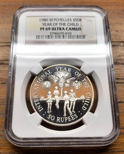 泉海漫舟·凡希社世界钱币微拍第三百十四期 - 1980塞舌尔儿童年50R大银精铸NGC-PF69UC