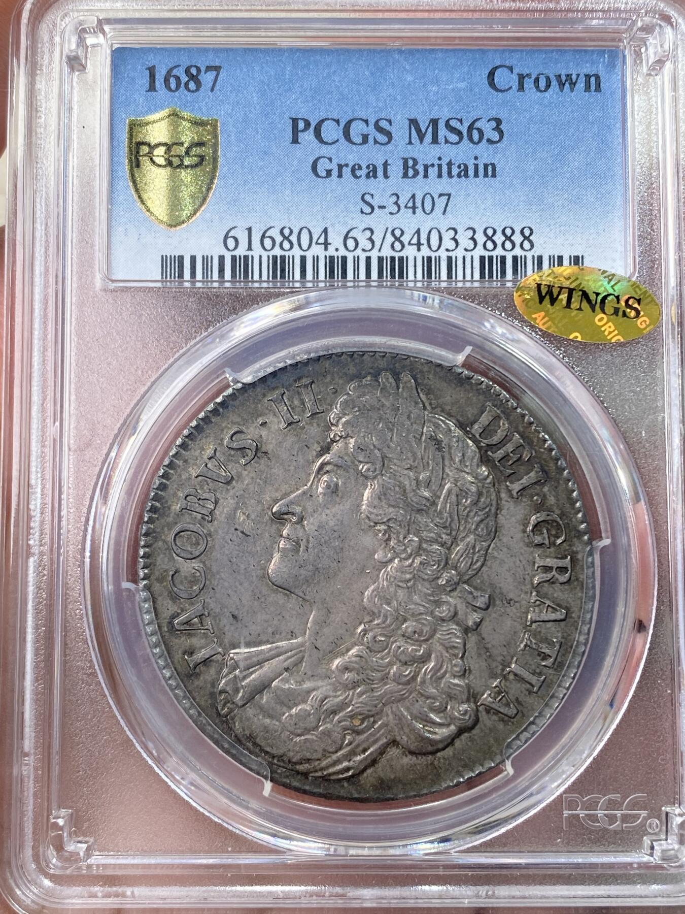 万国钱币拍卖第055期 PCGS MS63 1687年英国詹姆斯二世克朗 斯图亚特王朝复辟后第二位国王 柔美的英式乌云五彩倒影包浆 机铸纹清晰可见 底板转光依旧 WING金标认证的顶级状态 对于一枚17世纪的英国克朗来说已是可遇不可求的典藏品质