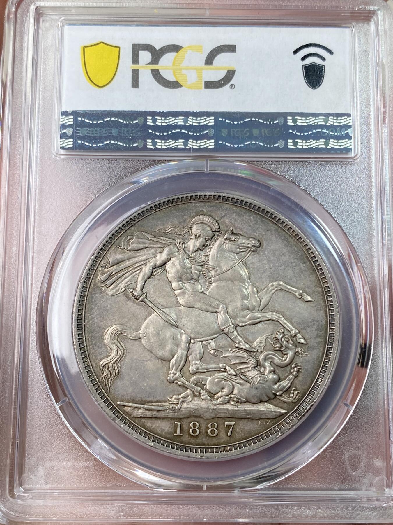 万国钱币拍卖第055期 PCGS MS63 1887年英国维多利亚女皇高冠马剑克朗 英系乌云酱彩包浆