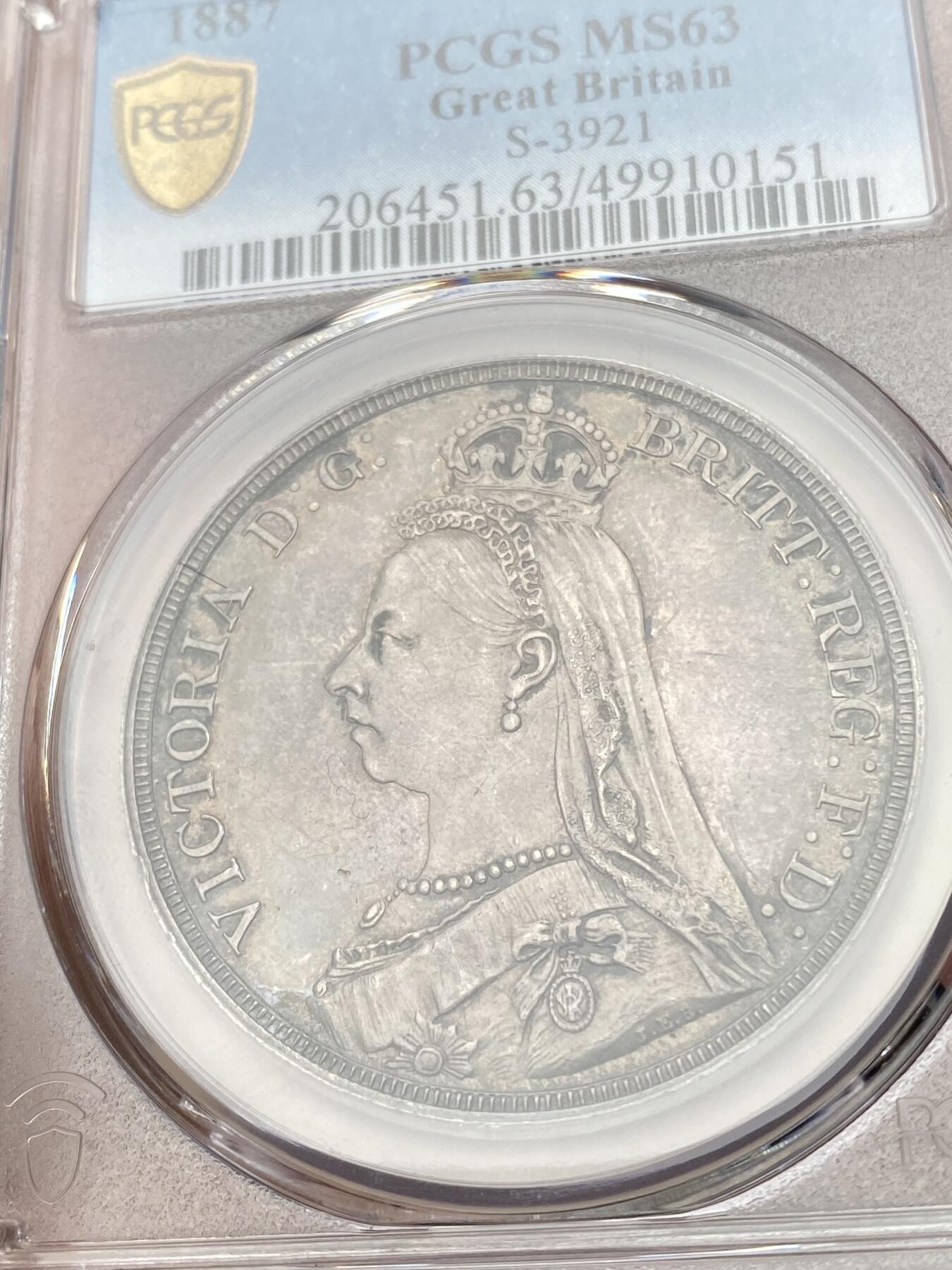 万国钱币拍卖第055期 PCGS MS63 1887年英国维多利亚女皇高冠马剑克朗 英系乌云酱彩包浆
