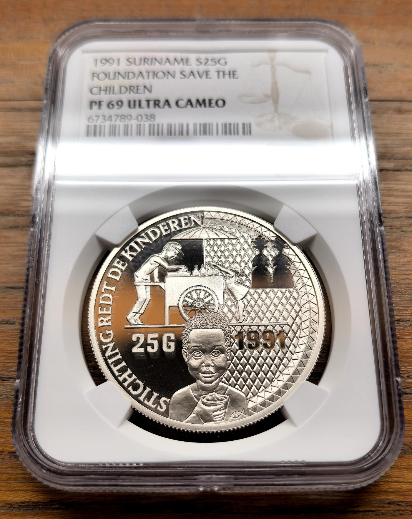 泉海漫舟·凡希社世界钱币微拍第三百十四期 1991苏里南保护儿童基金会纪念25G大银NGC-PF69UC