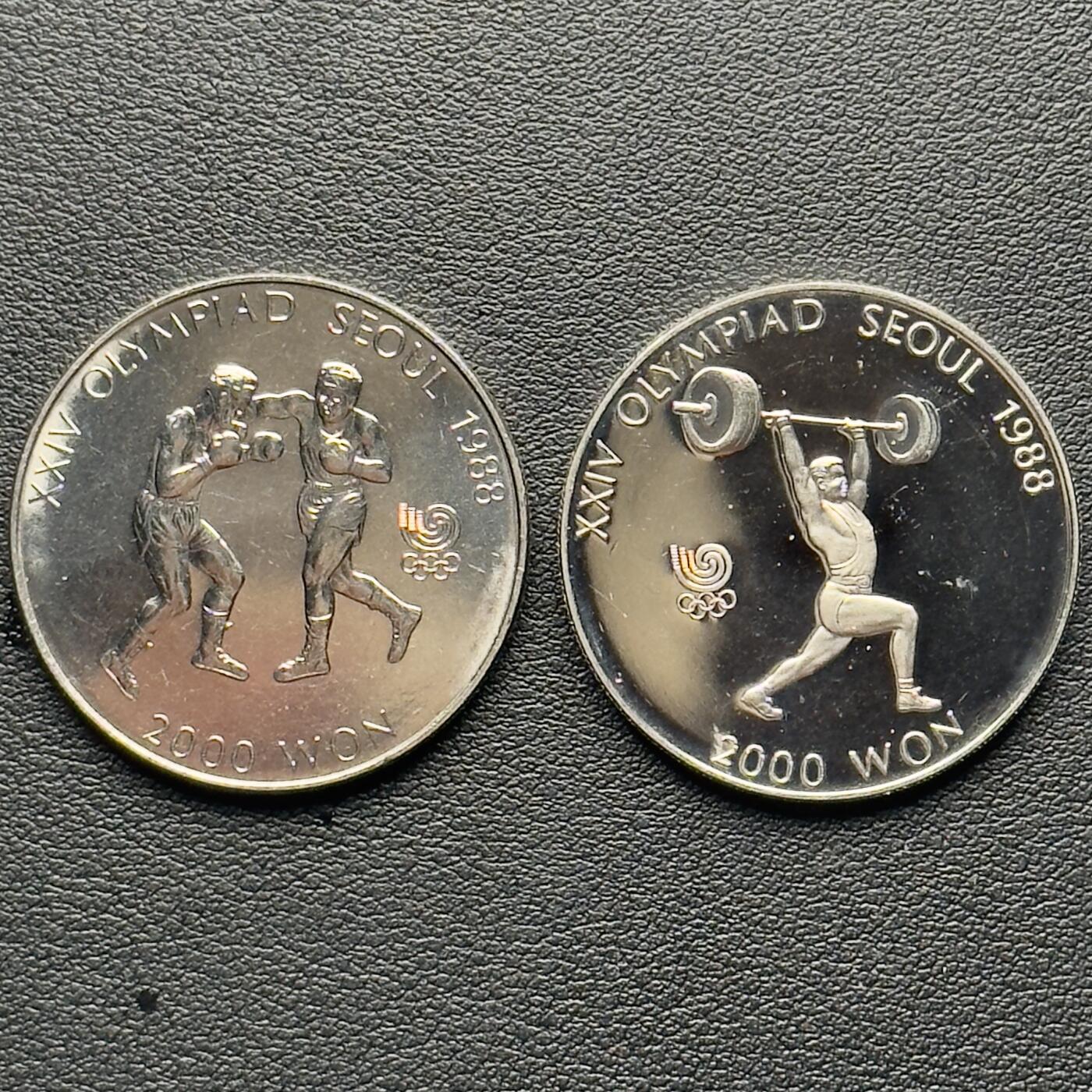＜小葵钱铺＞第65期·散币·银币场·满200包邮，不寄存·17号发货 韩国1986年、1988年汉城奥运会1000元纪念币2枚（1精制，1普制）