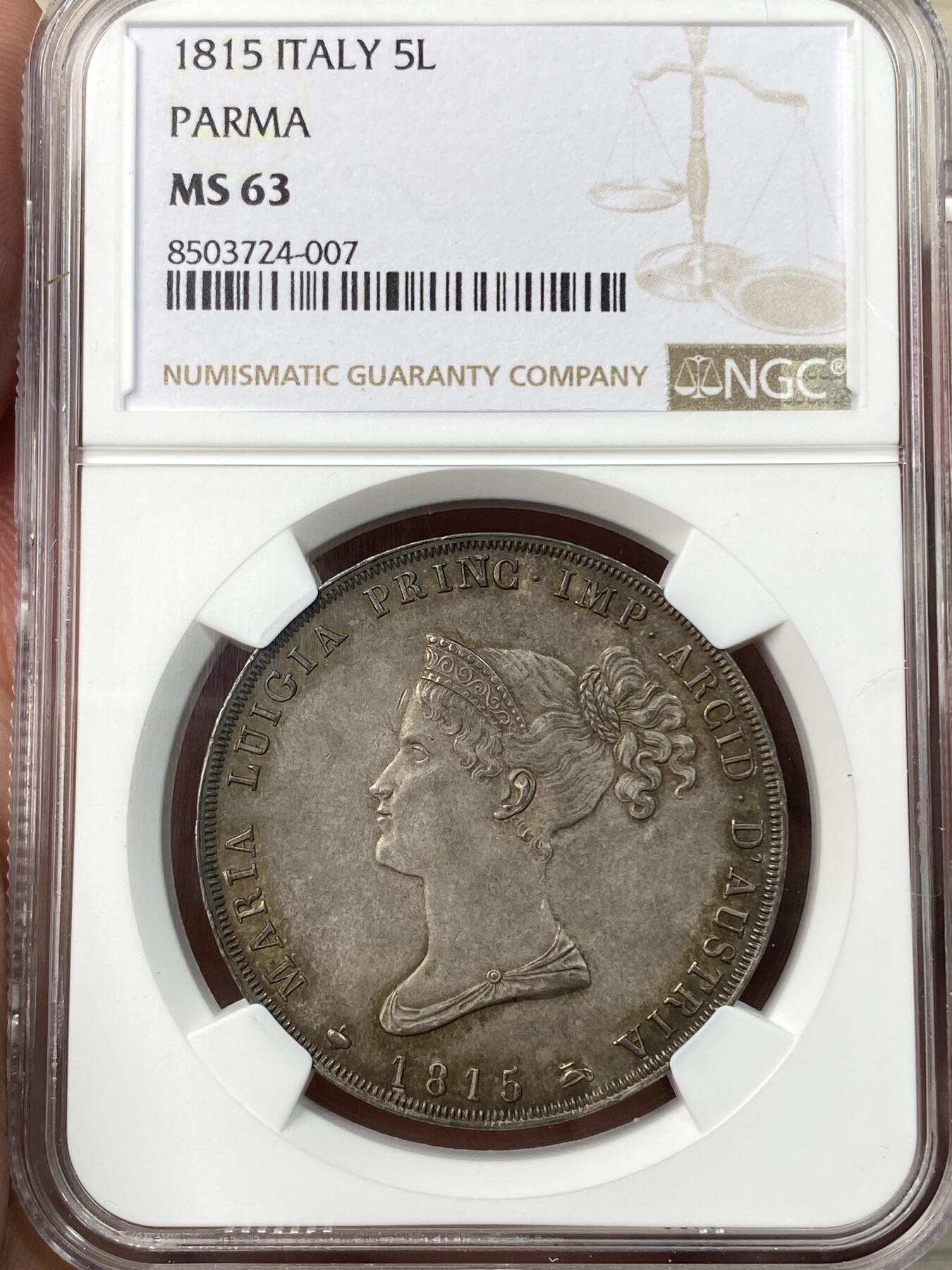 万国钱币拍卖第055期 NGC MS63 1815年意大利帕尔马5里拉银币 正面肖像为拿皇夫人，著名的帕尔马女大公玛丽亚·露易丝，背面是繁复华丽的帕尔马公国纹章，双面均匀欧陆五彩，国际市场广受欢迎的品种，好品也是越来越难见到，此等典藏级品质不可错过。