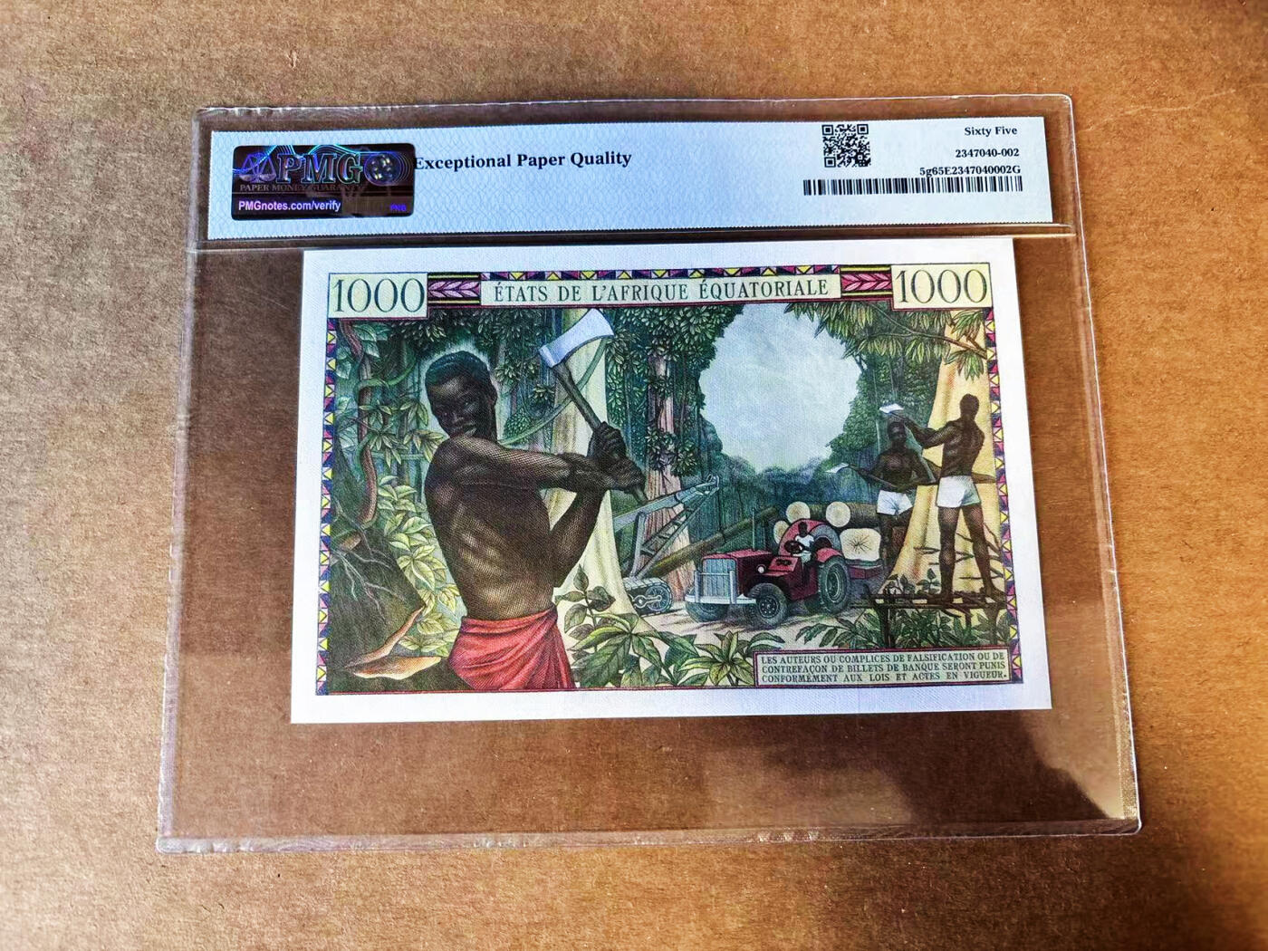 【Blue Auction】世界纸币精拍第751期——18级TOP拍卖/信誉/品质/专业/高效💫 【仅2张更高分 无47】赤道非洲 1963年1000法郎 刚果版 集市熙熙攘攘的热闹场景 当地色彩艳丽纹饰精美的衣着 经典砍木头 PMG65EPQ 法属玩家值得收藏