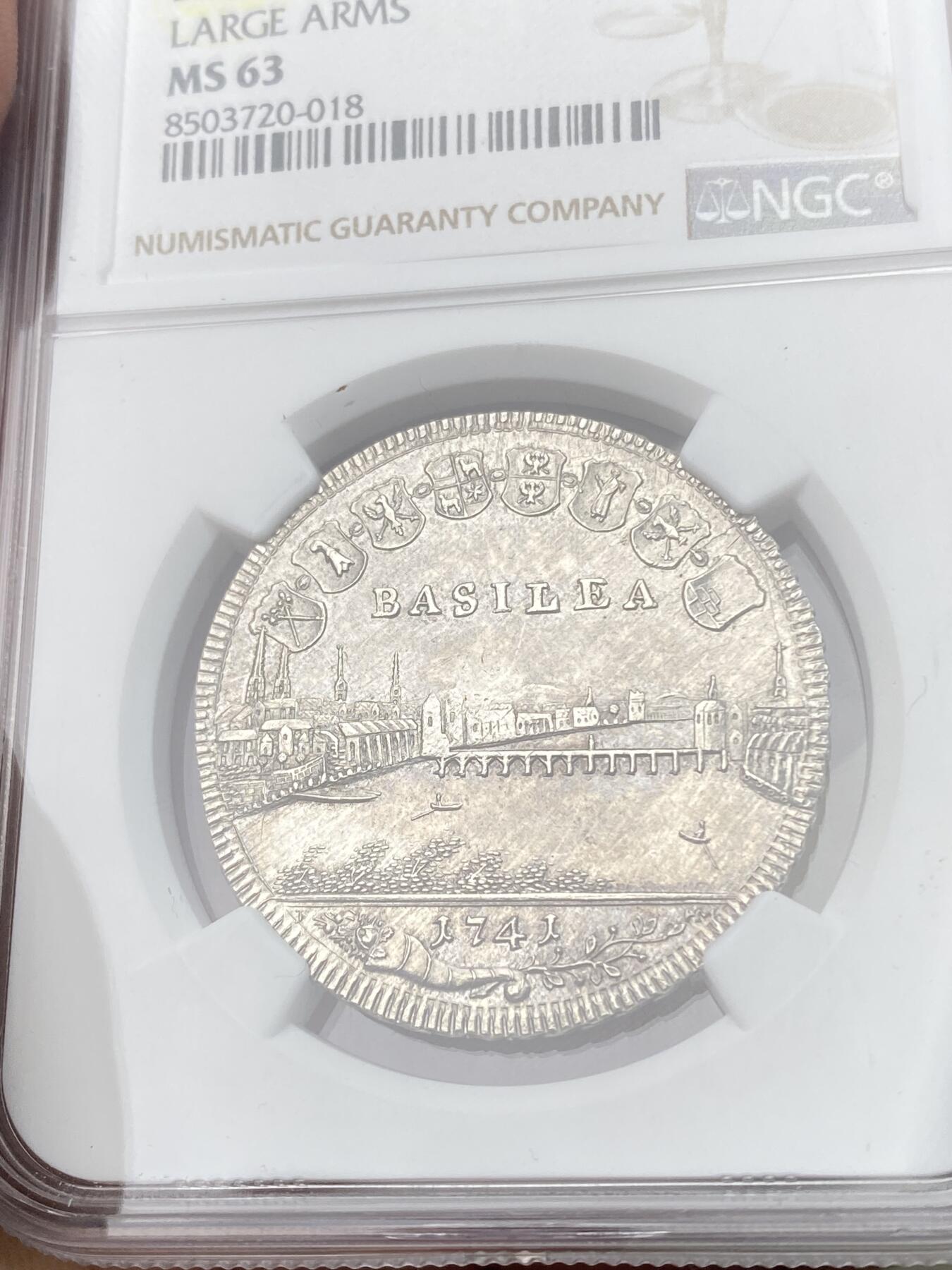 万国钱币拍卖第055期 NGC MS63 1740年瑞士巴塞尔景观1/2半泰勒 经典瑞士景观品种 银霜全深打极其难得 巴塞尔怪兽巴西利斯克身上的鳞片粒粒可数 城市细节一览无余 顶级收藏状态