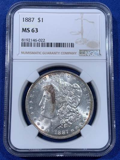 《竞宝斋》第438场 周日，周一，周二 3场连拍 （全场包邮） - NGC MS63 美国1887年摩根银币 趣味包浆彩，有一定把玩性，比较特殊。