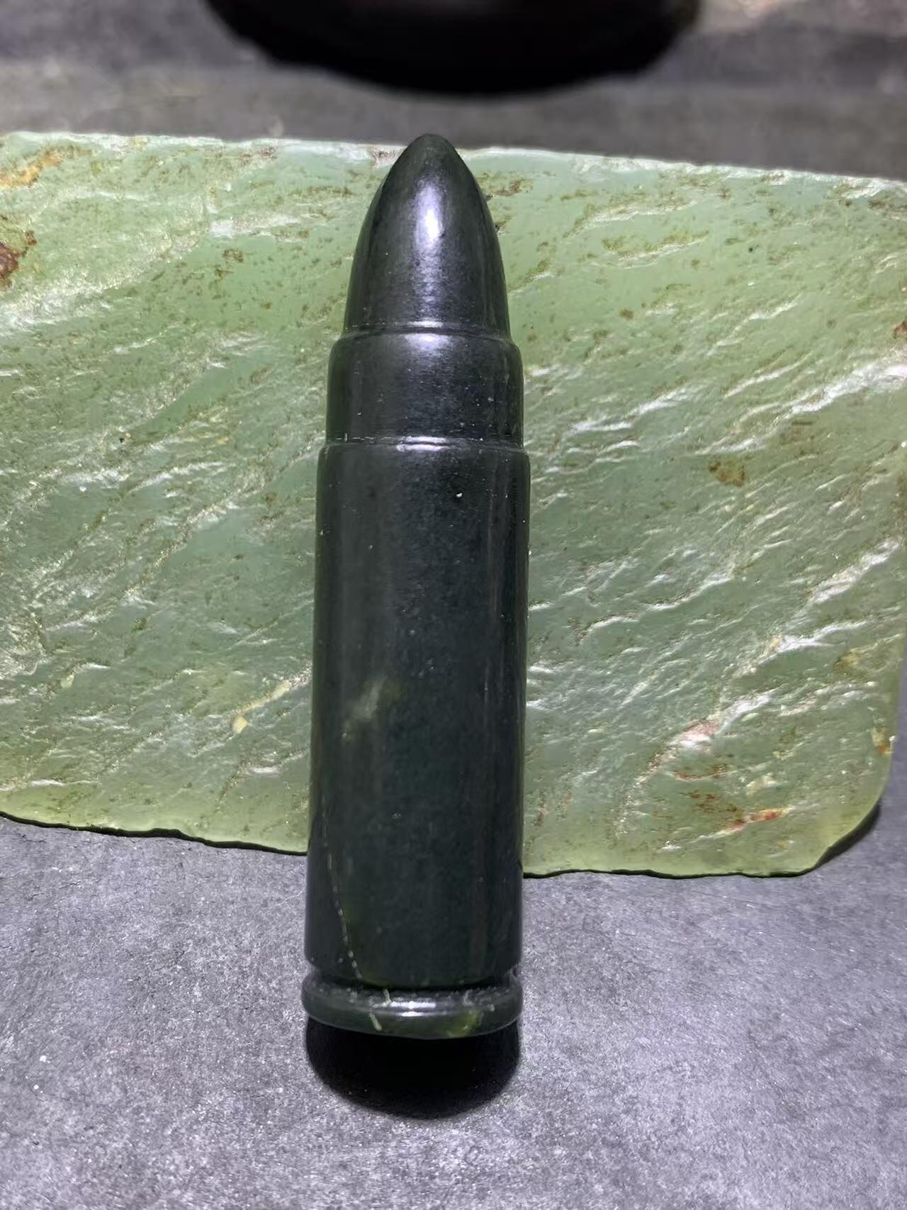 天然新疆和田青玉子 弹通货吊坠1颗，