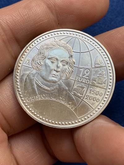 《竞宝斋》第438场 周日，周一，周二 3场连拍 （全场包邮） 西班牙2006年克里斯托弗·哥伦布逝世500周年12欧元银币，正面为哥伦布，背面为胡安·卡洛斯一世和索菲亚，转光好品，925银，18克。