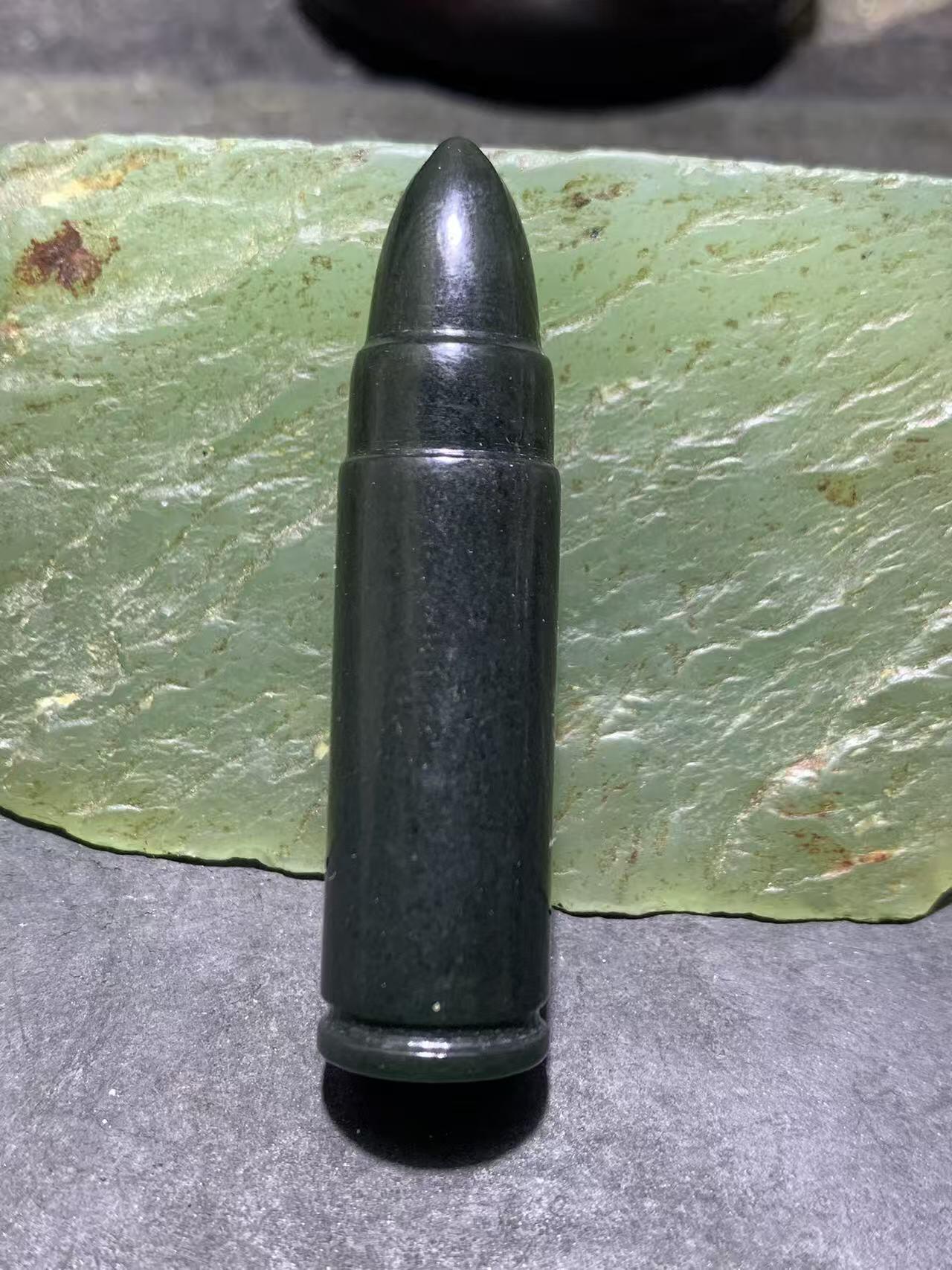 天然新疆和田青玉子 弹通货吊坠1颗，