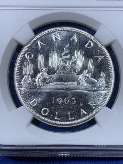 《竞宝斋》第438场 周日，周一，周二 3场连拍 （全场包邮） NGC PL66 加拿大1963年小伊1元划船大银币，飘带青年头像伊伊，年轻头像的关门年份，比中年版少见太多。品相极佳，PL状态超群