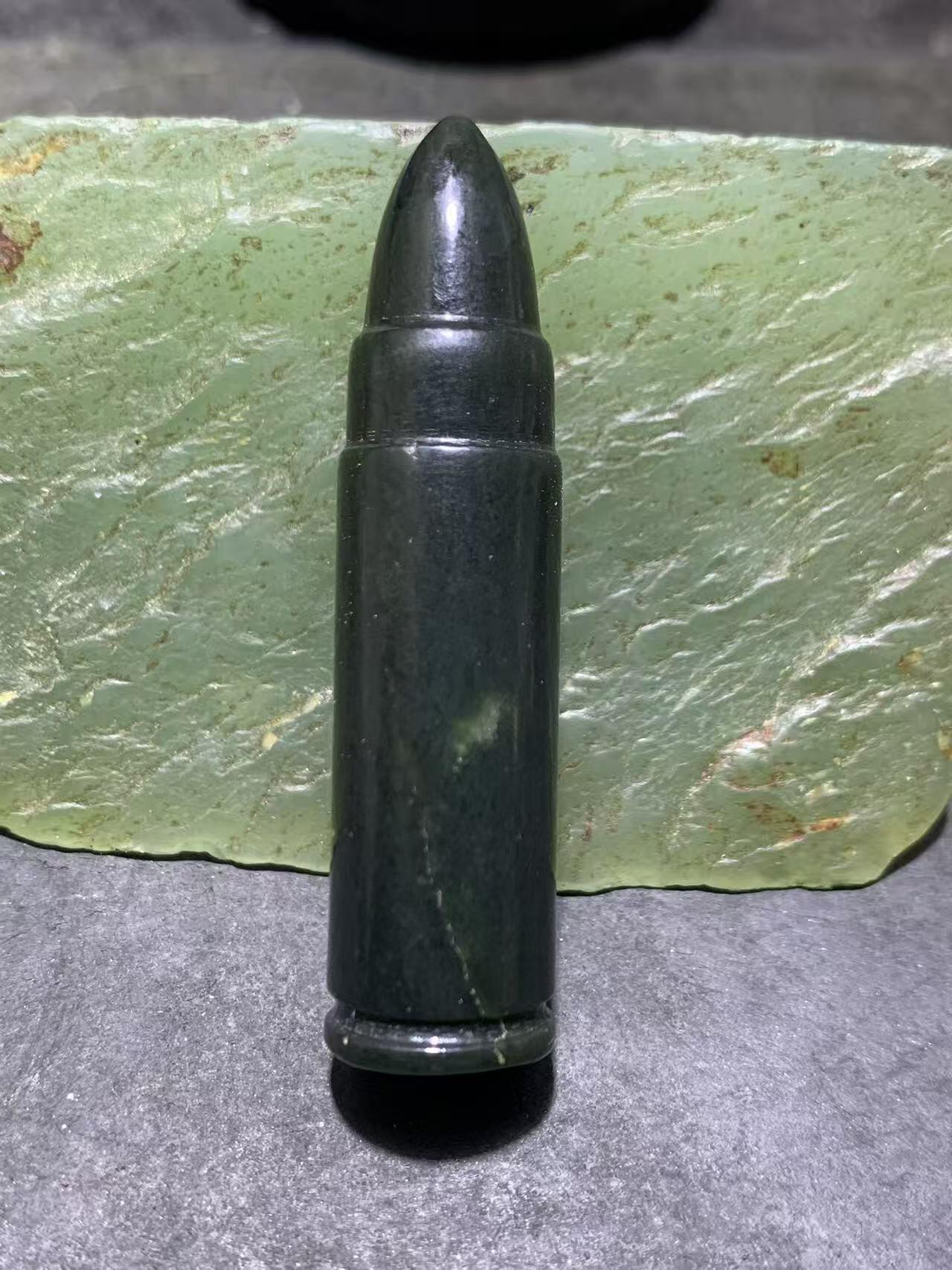 天然新疆和田青玉子 弹通货吊坠1颗，