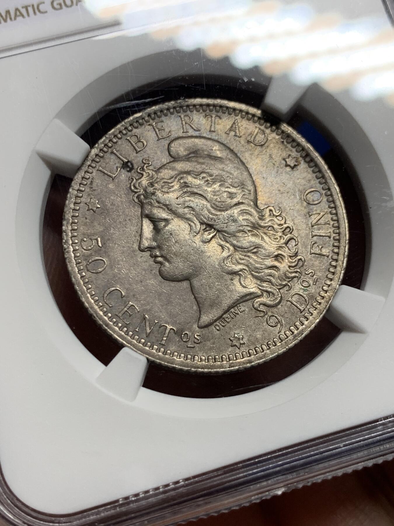 《竞宝斋》第439场 周日，周一，周二 3场连拍 （全场包邮） NGC AU58 阿根廷1883年自由女神50分银币 酱彩金五彩老黑包浆，深打有细节