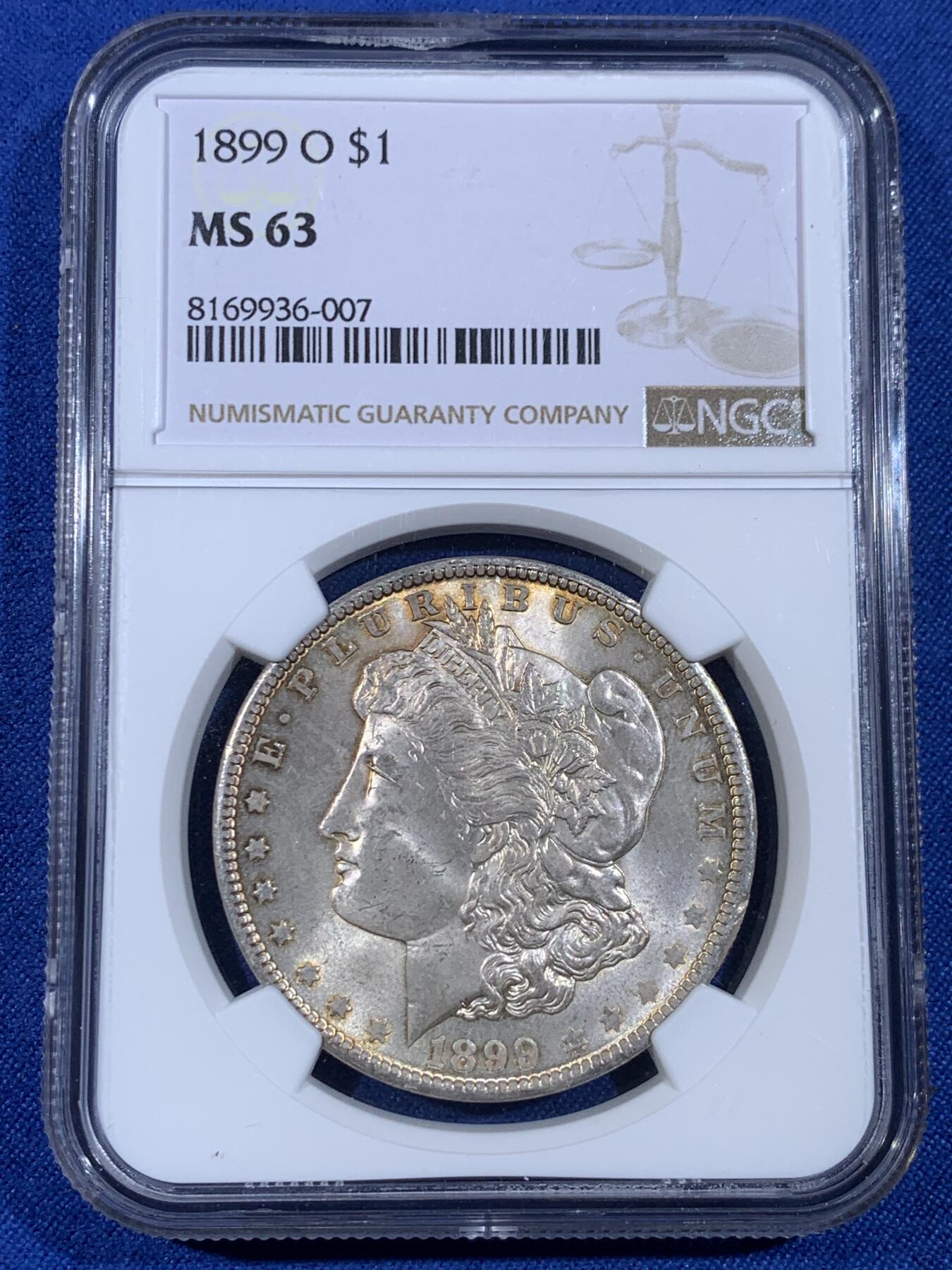 《竞宝斋》第439场 周日，周一，周二 3场连拍 （全场包邮） NGC MS63 美国1899年摩根银币O版 正反都有淡金彩包浆 不太常见的年份