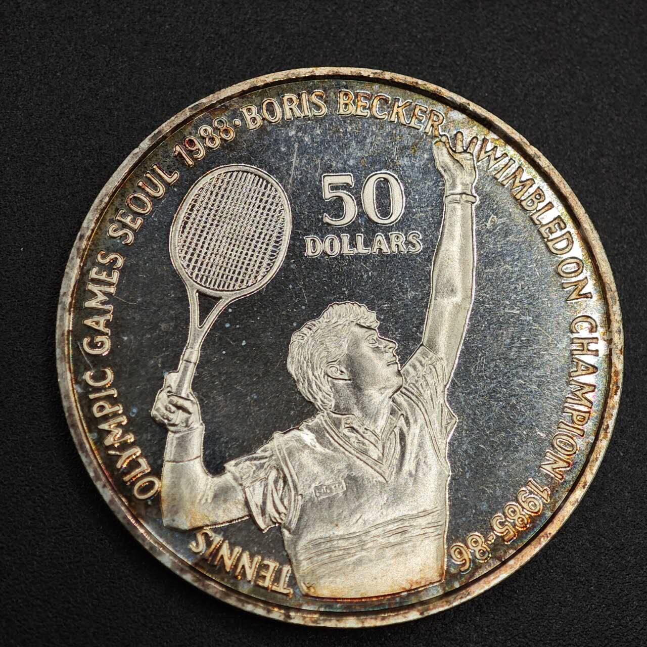 【淘币小摊】实时拍第七百九十九拍   银币套币场   满百包邮可预留二周 每周一统一发货   纽埃1987年50元网球纪念银币彩色包浆 重27.1克625银 银价195